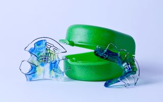 Image of plates or an orthodontic retainers, an dental treatment that straightens teeth.