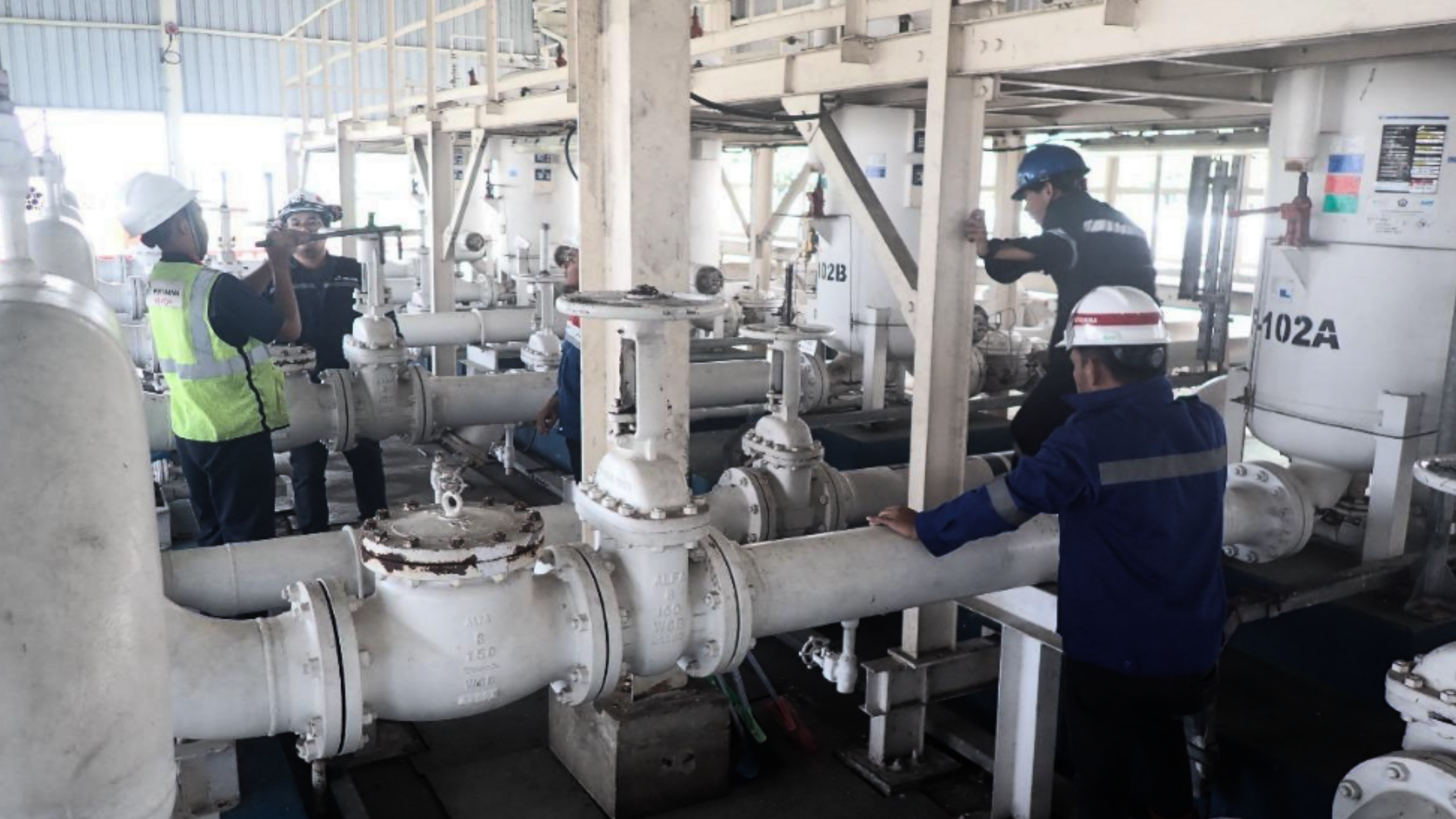 An engineer inspecting a machine