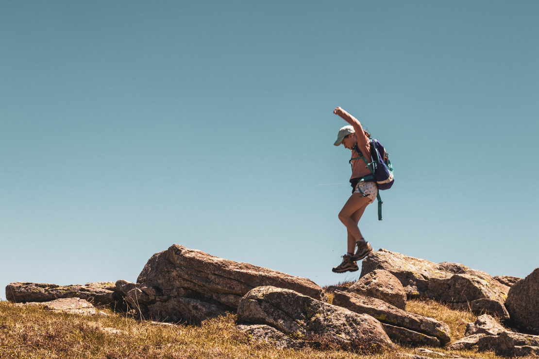 Girl Jumping Rock