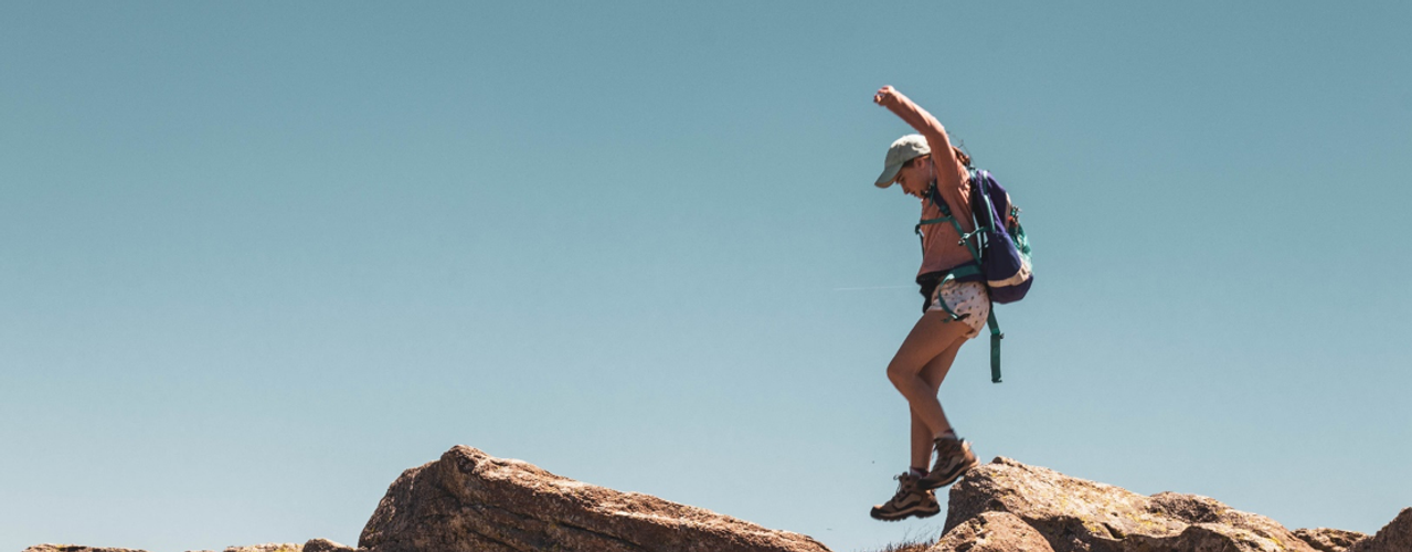 Girl Jumping Rock