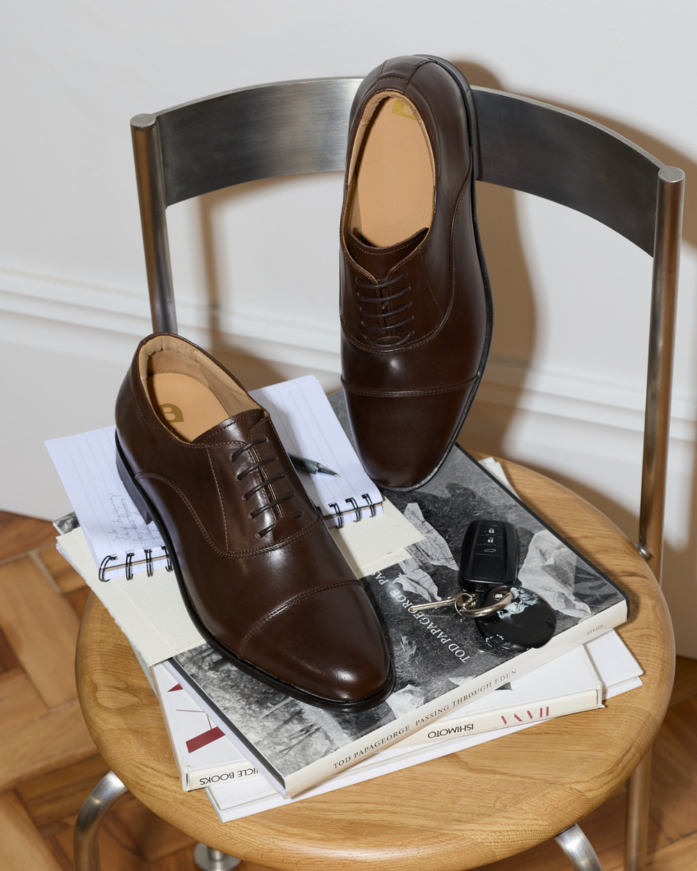 Pair of brown dress shoes on a chair