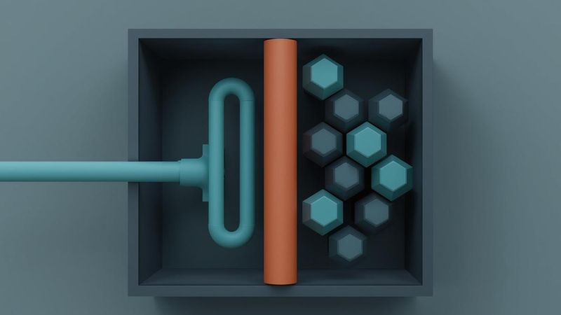 A minimalist vector illustration on a light ash-grey background showing a steel-grey industrial chamber. A stream of teal blocks representing water enters from the left, is cleanly split by a solid terracotta vertical line representing electrical current, and exits on the right as perfectly structured teal hexagons representing pure hydrogen.