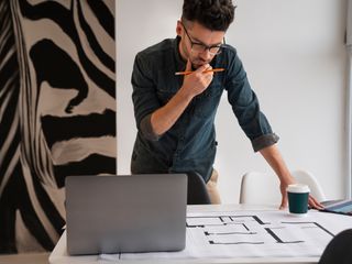 building designer reviewing plans