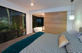 bedroom with plantlife built into wall