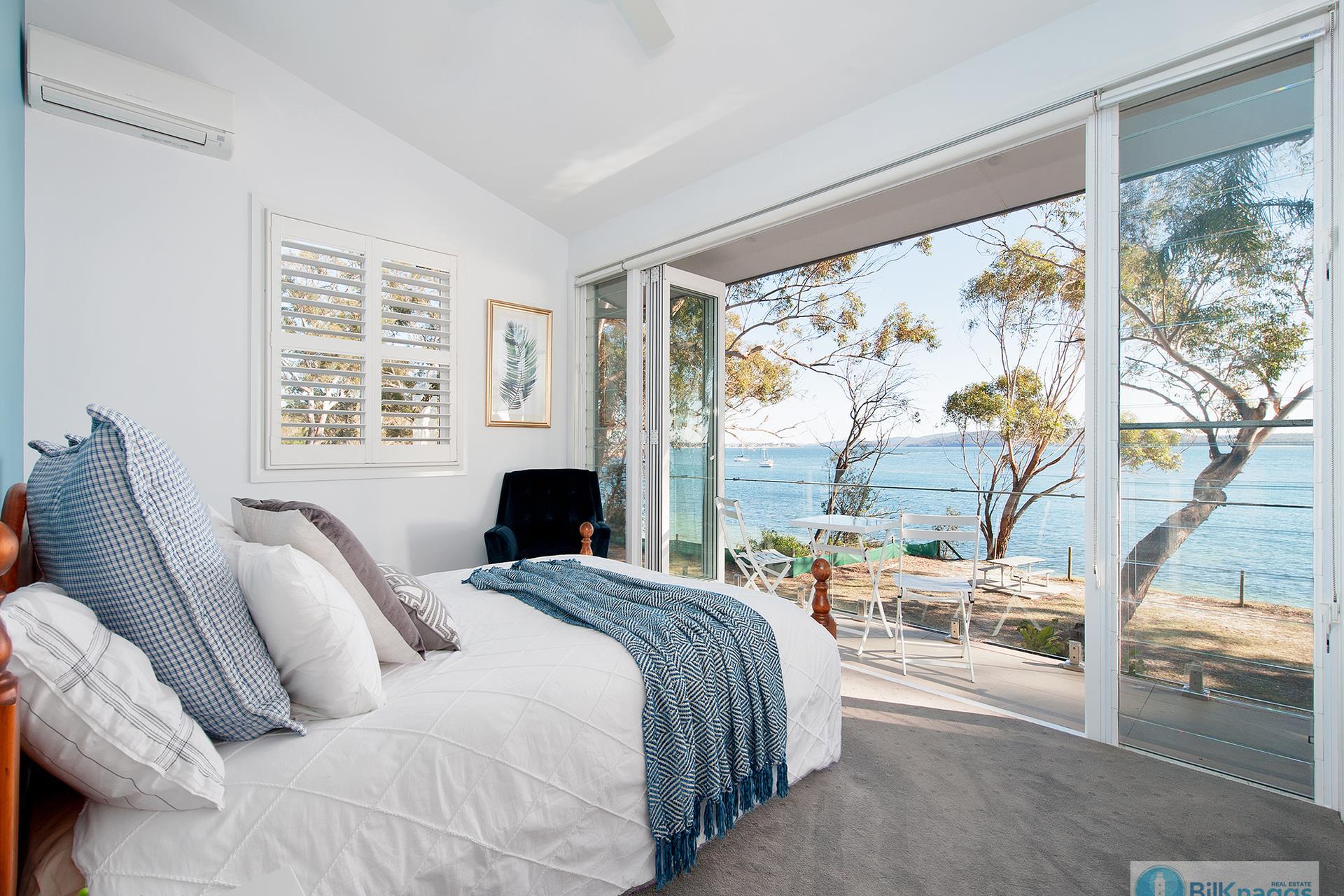 bedroom with waterfront views