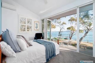 bedroom with waterfront views