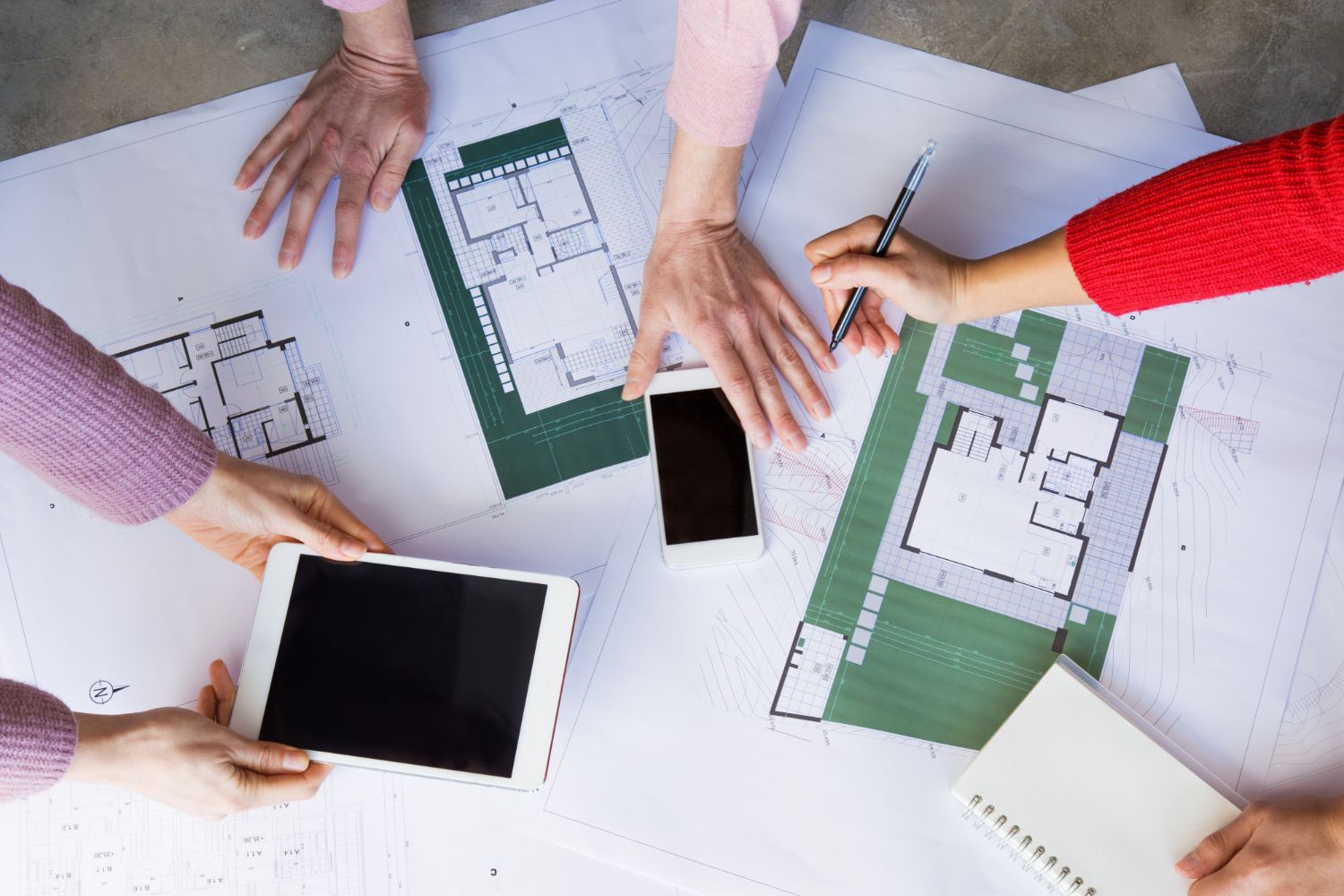 building designers looking over plans