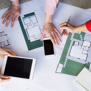 building designers looking over plans