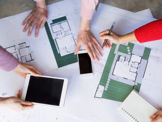 building designers looking over plans