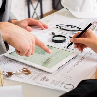 council officials discussing building approvals