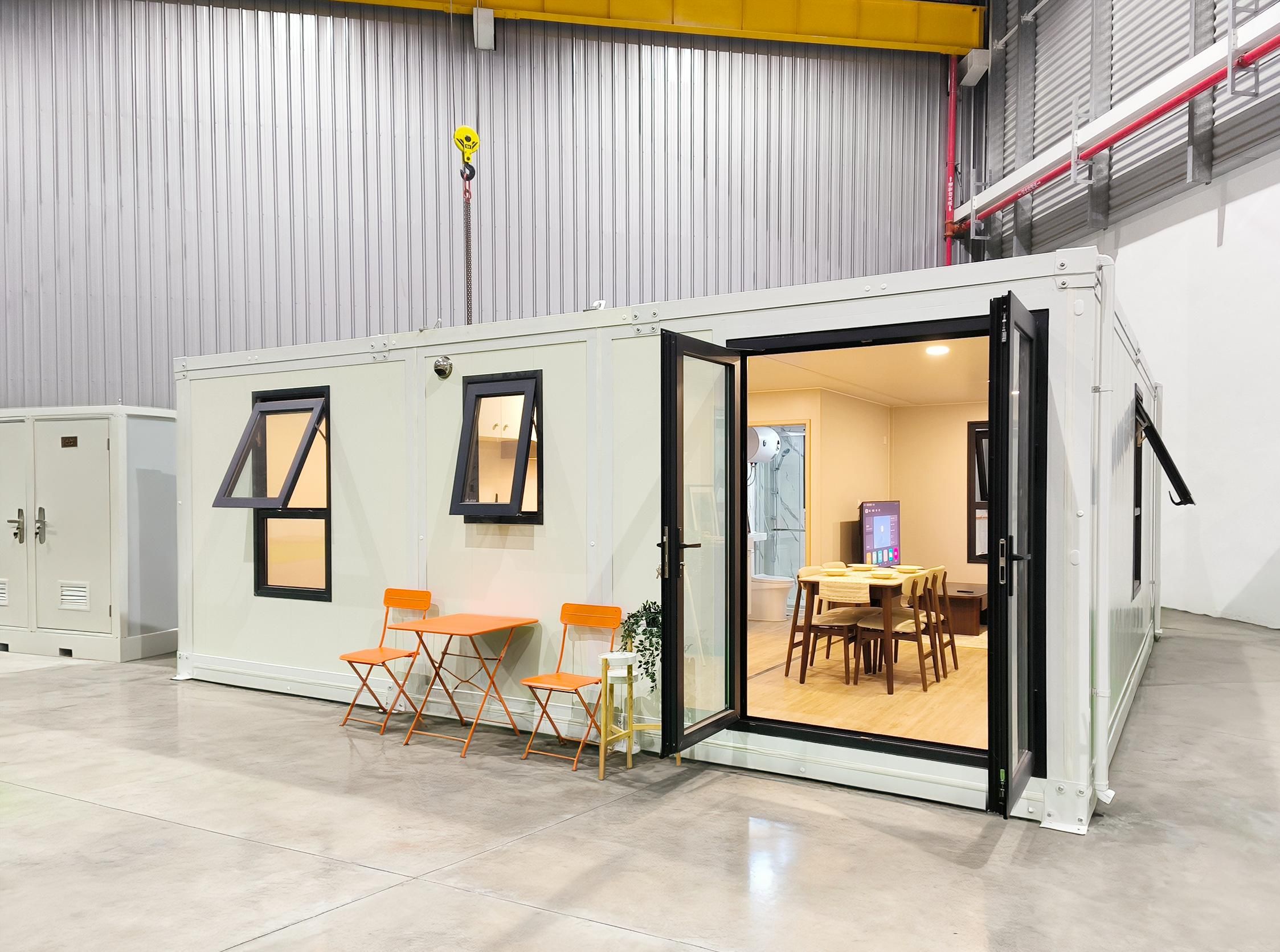 The PrefabX Annexe seen from outside, a two bedroom single storey home with a timber deck