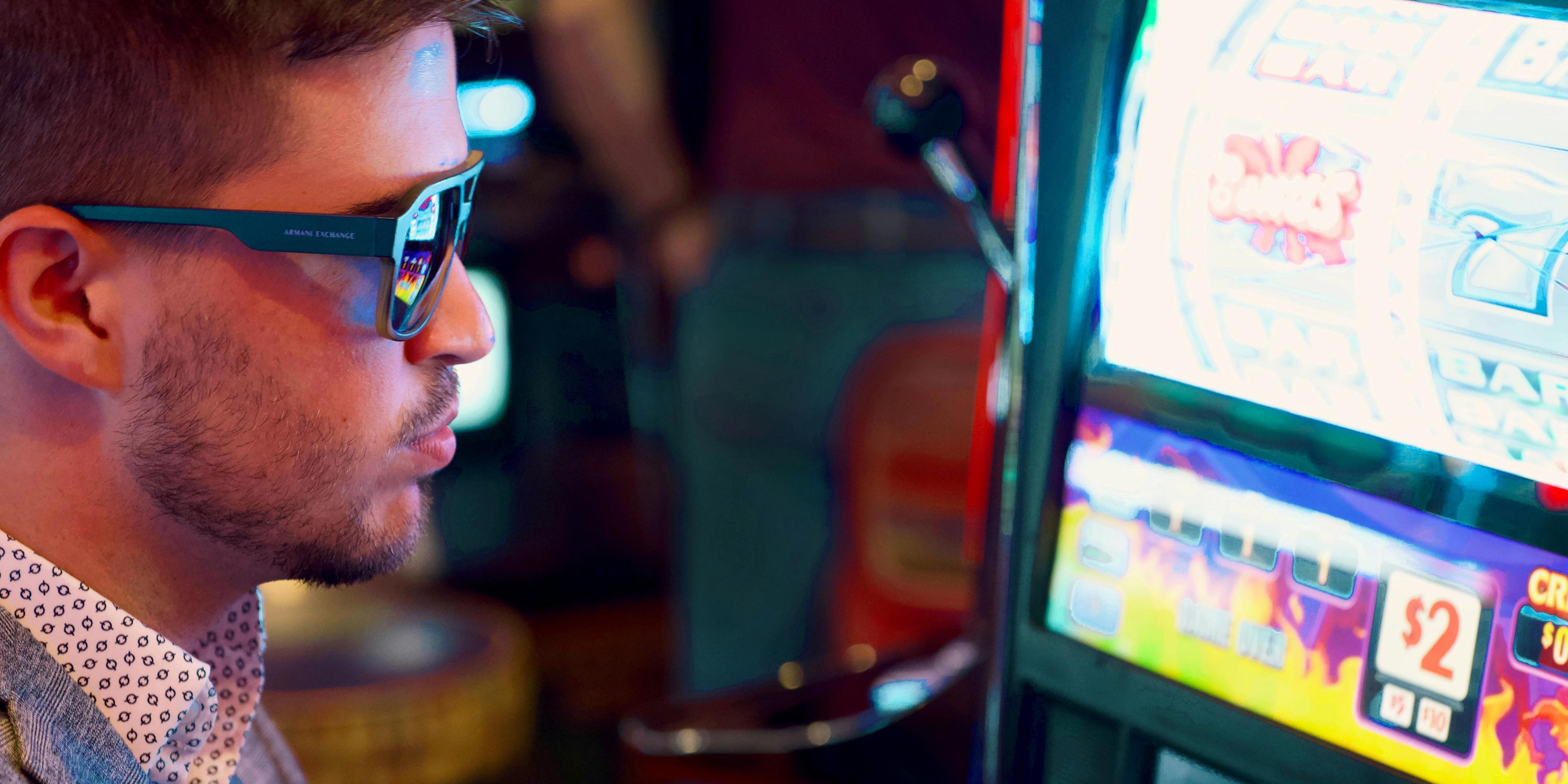 A person playing a slot machine