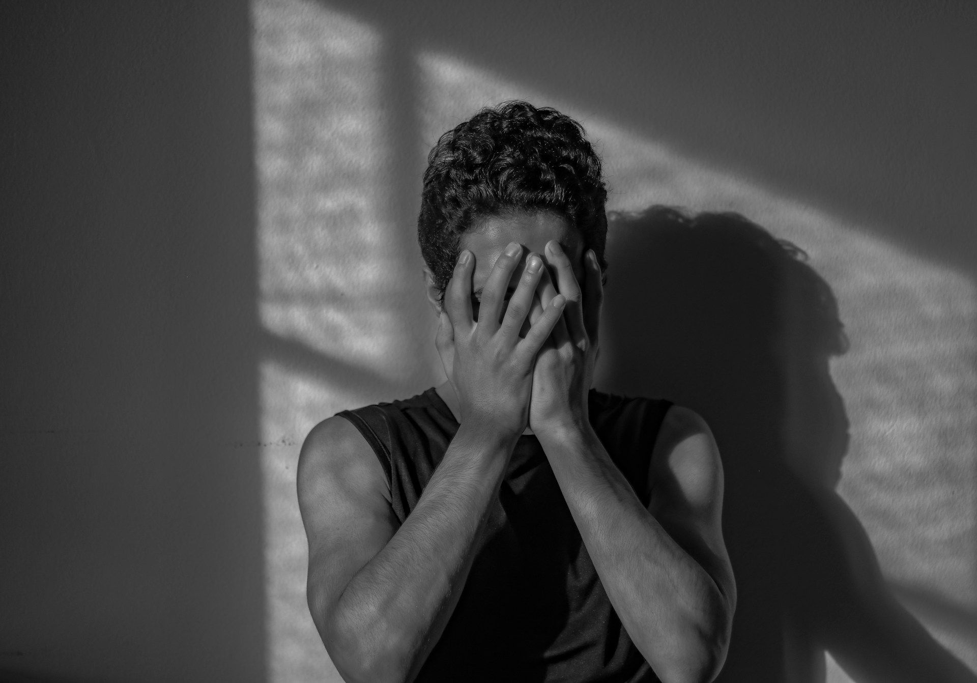 Person experiencing emotional distress and isolation