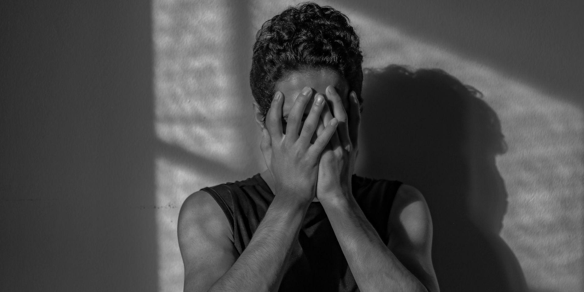Person experiencing emotional distress and isolation
