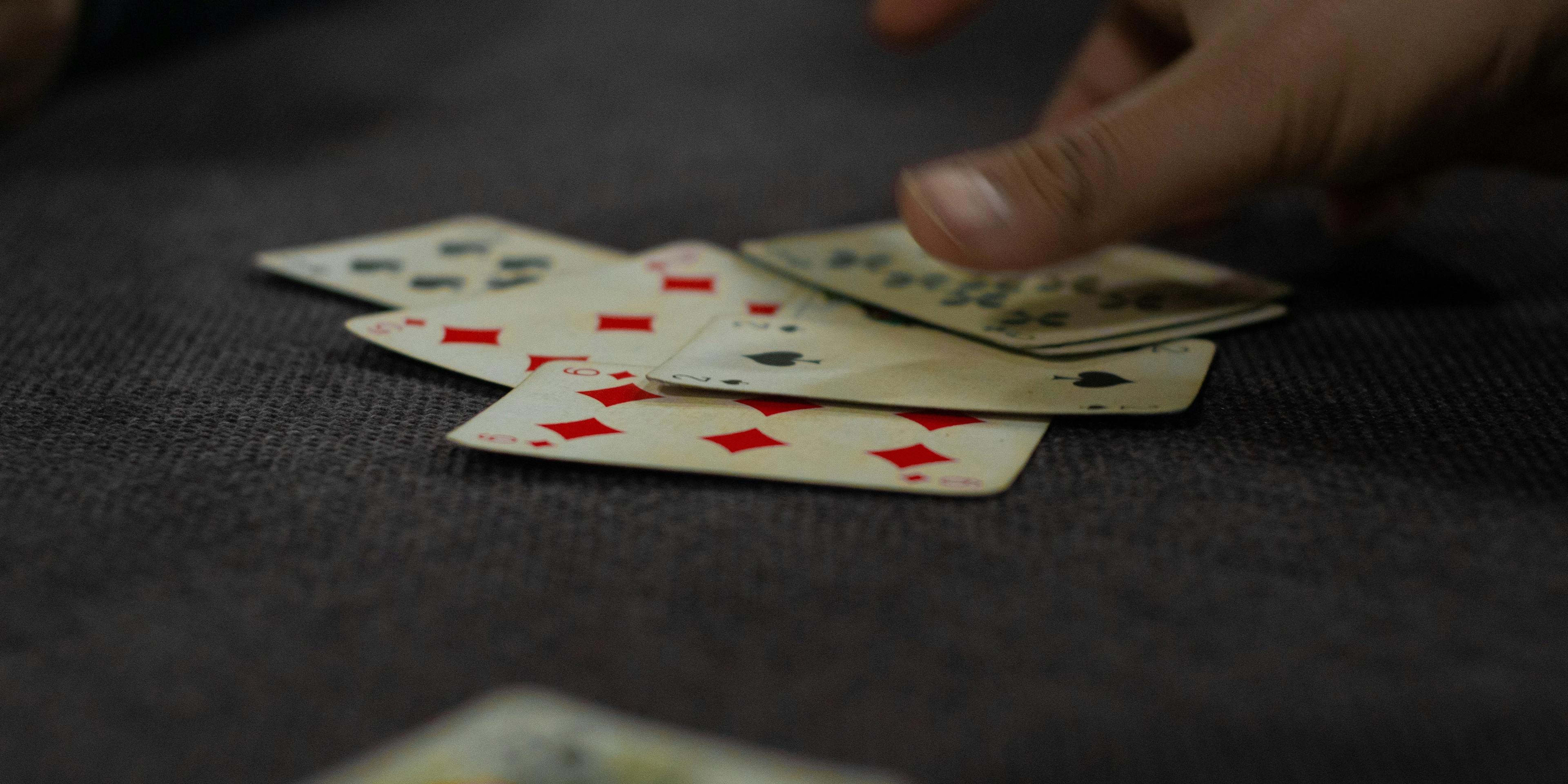 A person holding a deck of cards