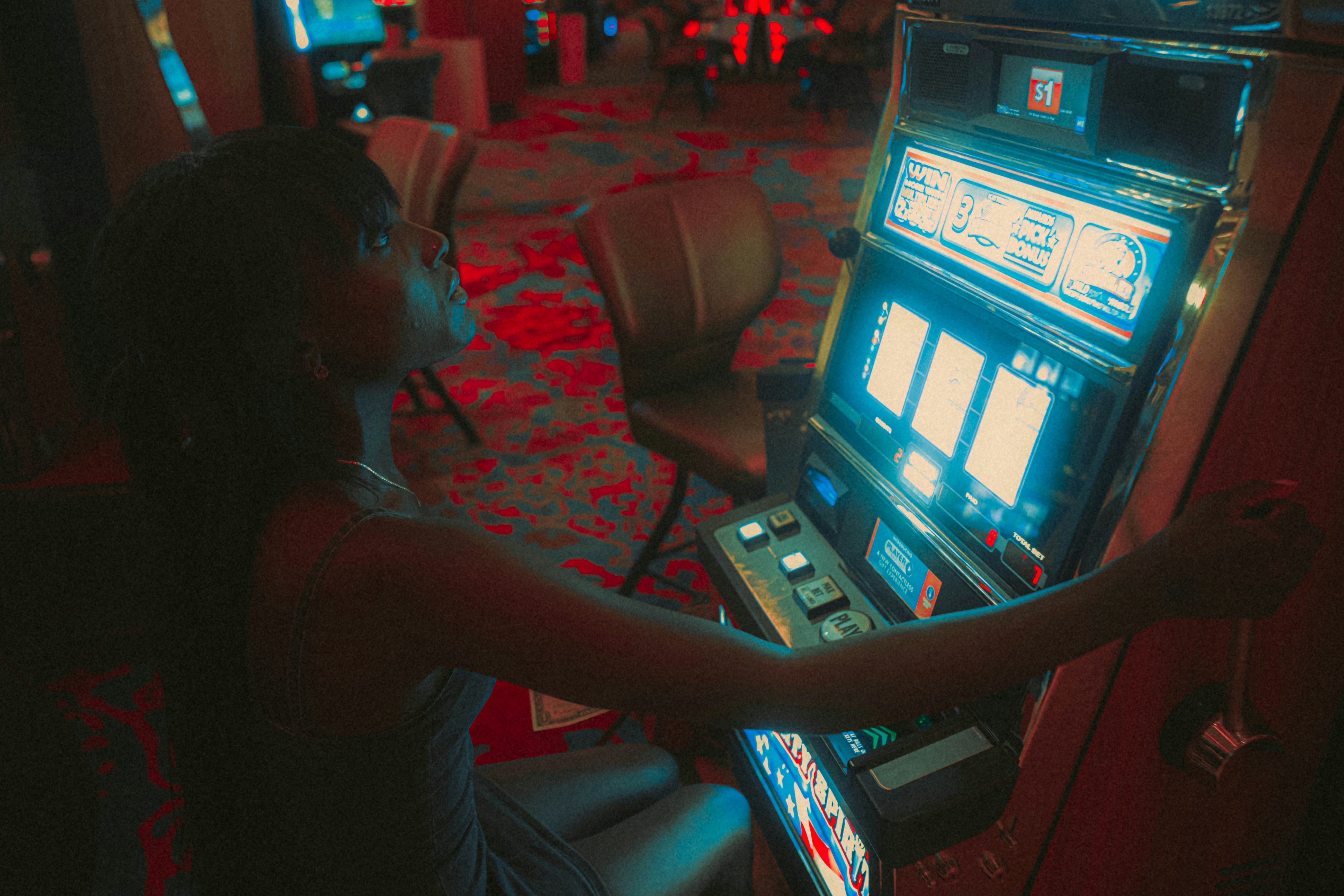 A person playing on a slot machine