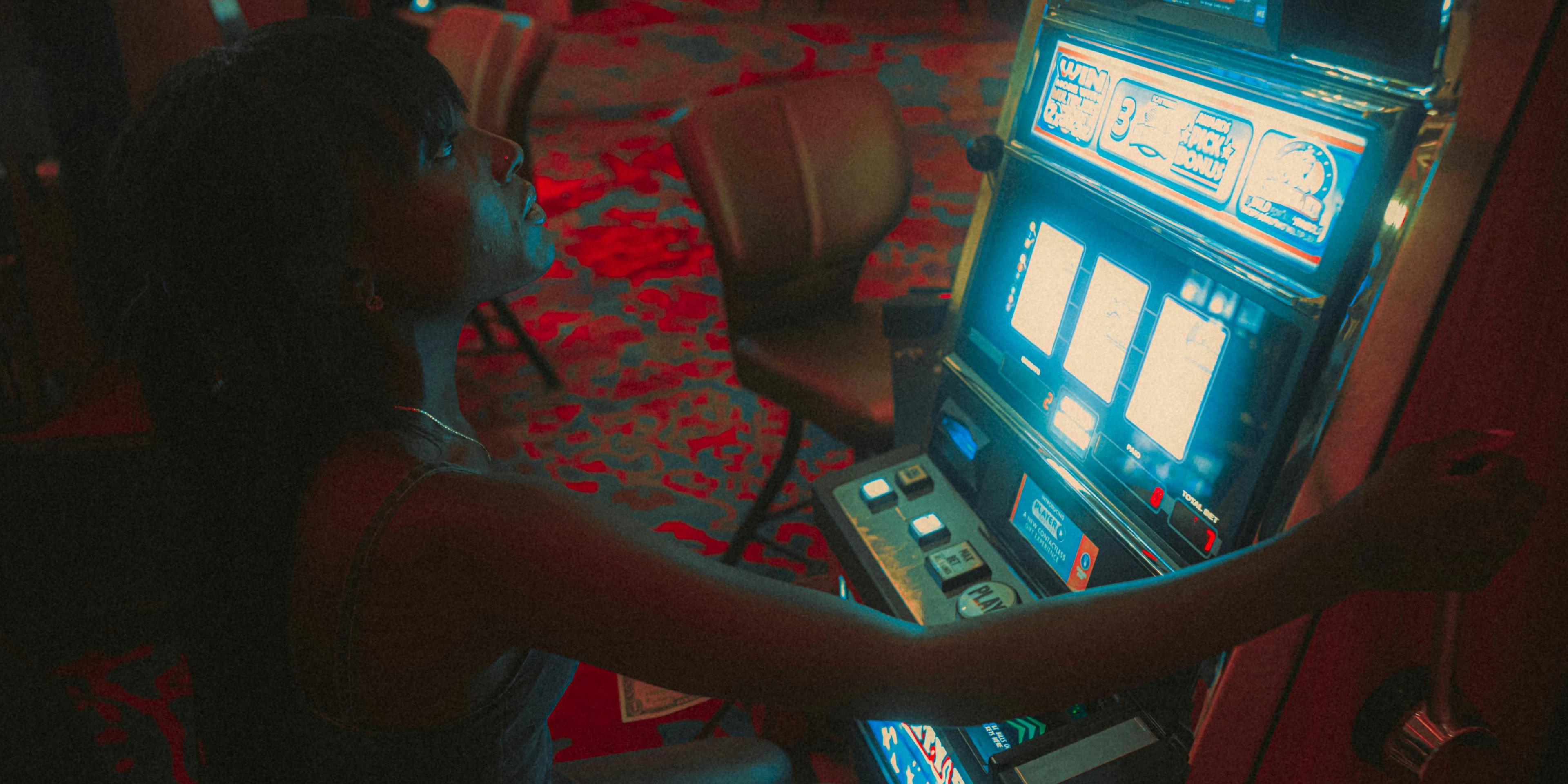 A person playing on a slot machine