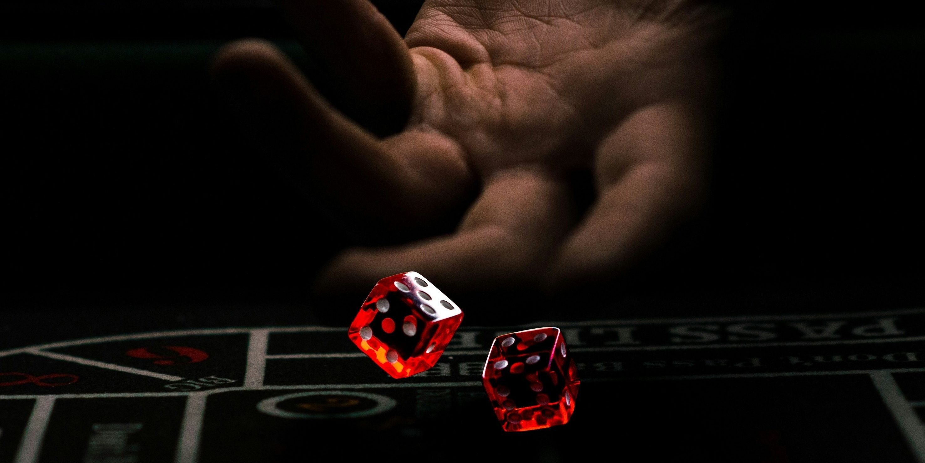 A person tossing a dice