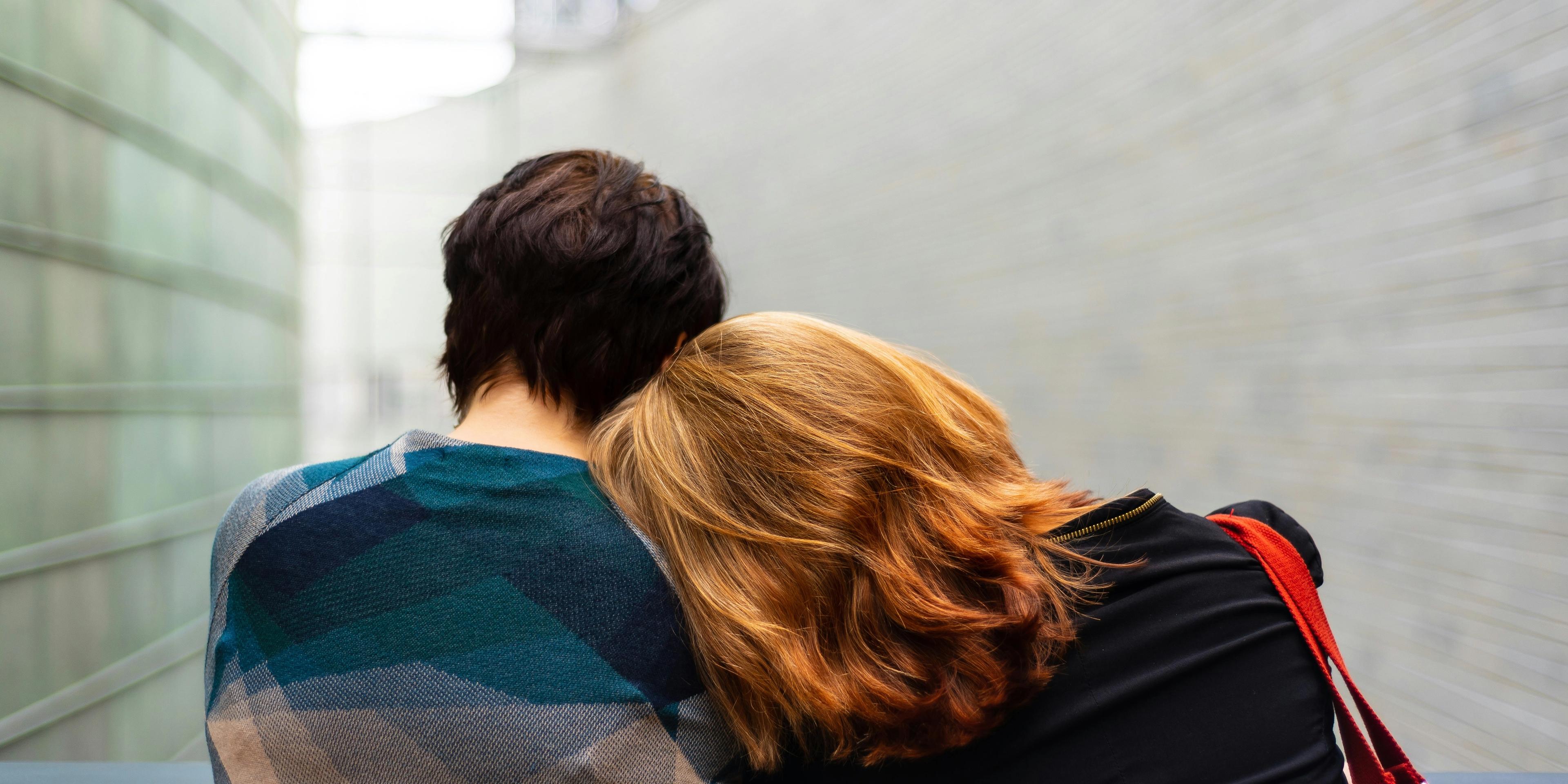 A person leaning on other shoulder