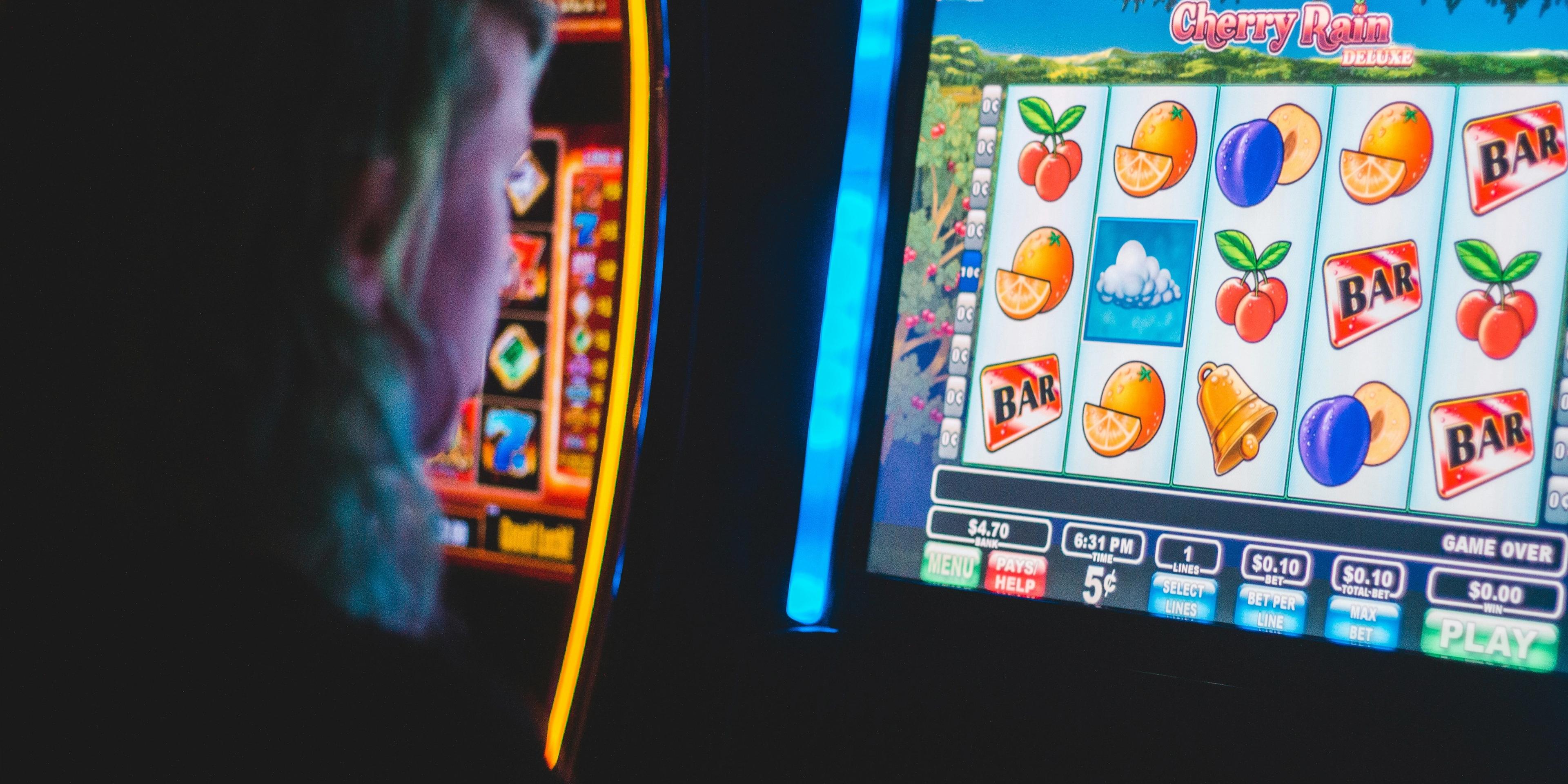 A person playing on a slot machine