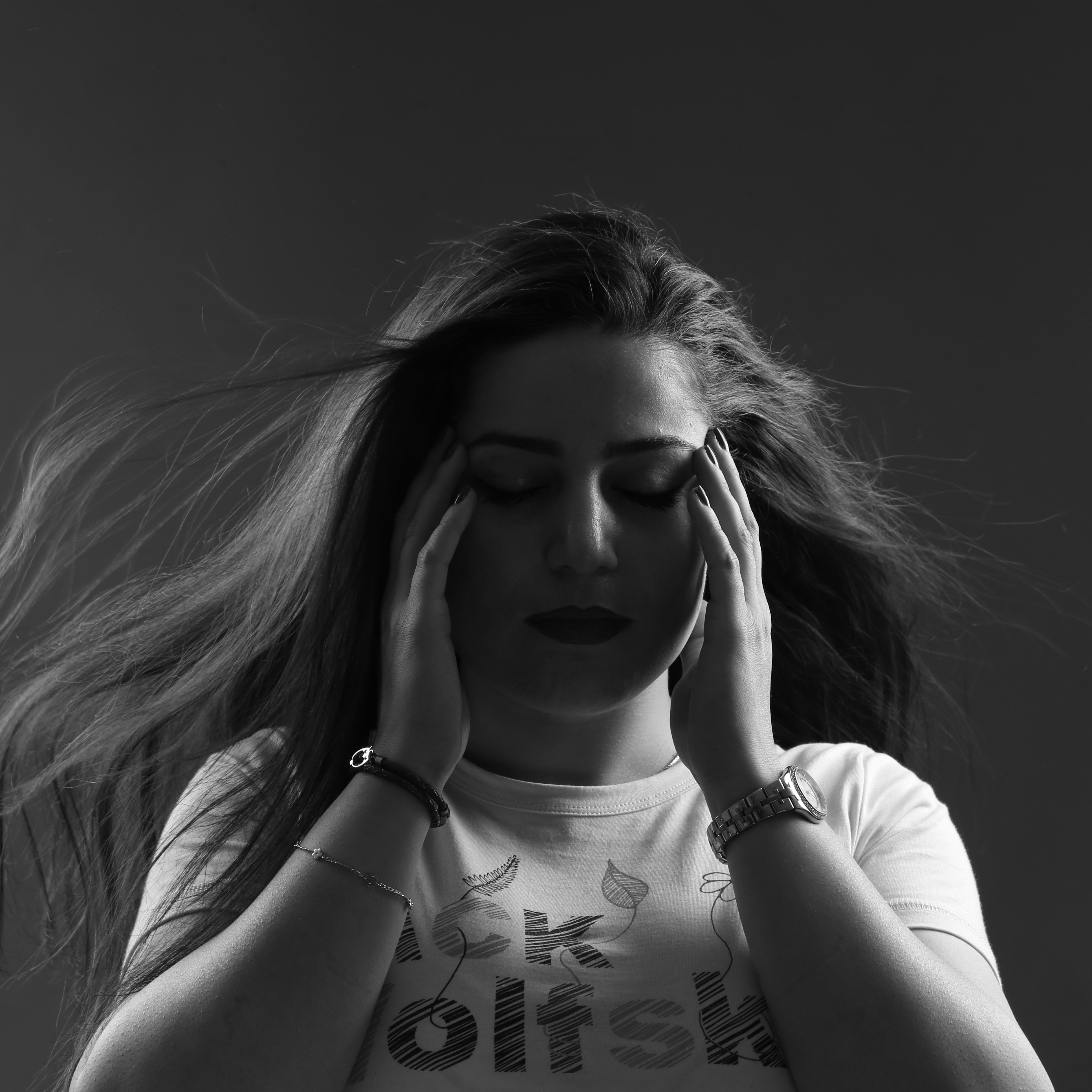 A person holding her head