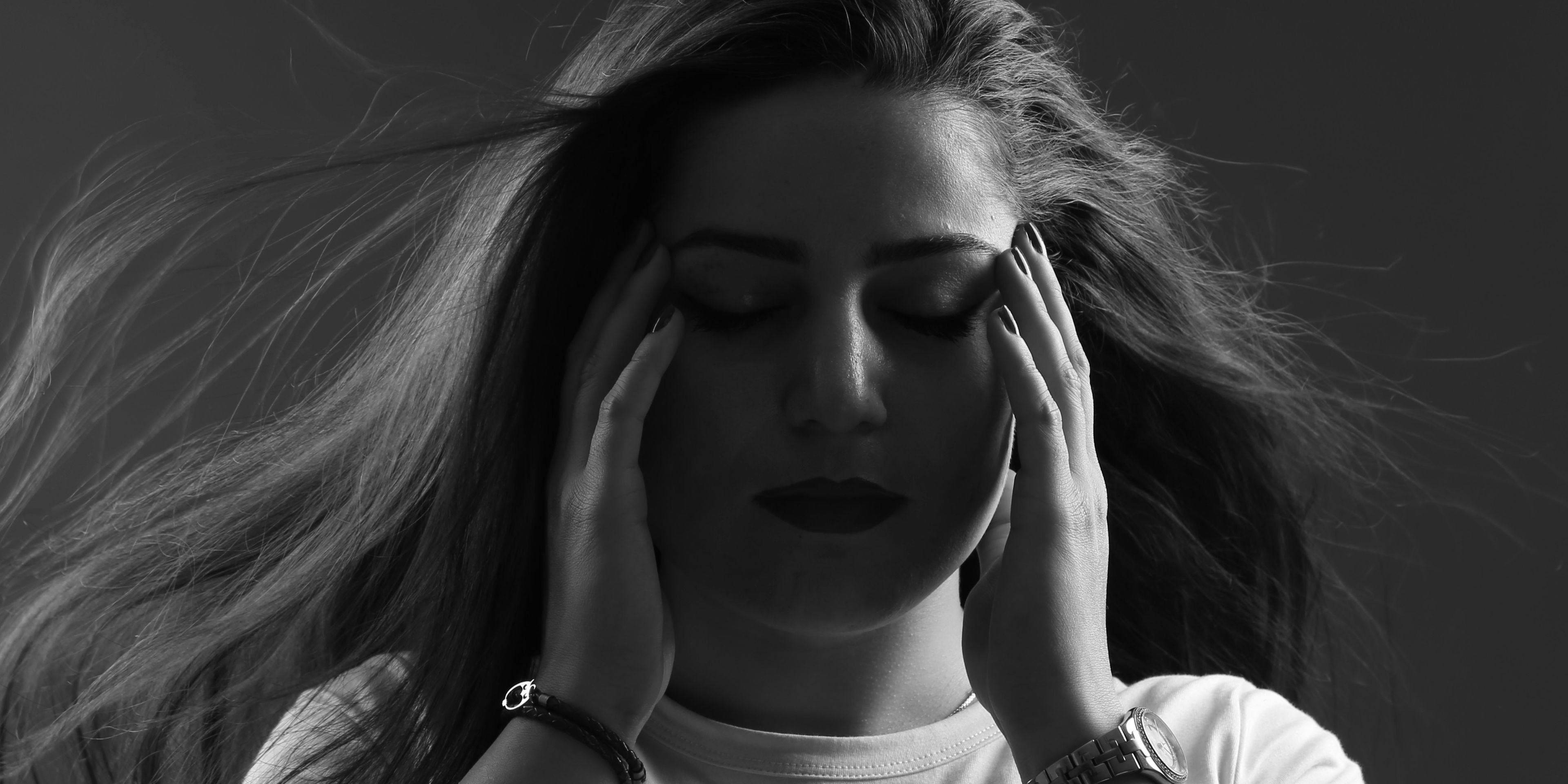 A person holding her head