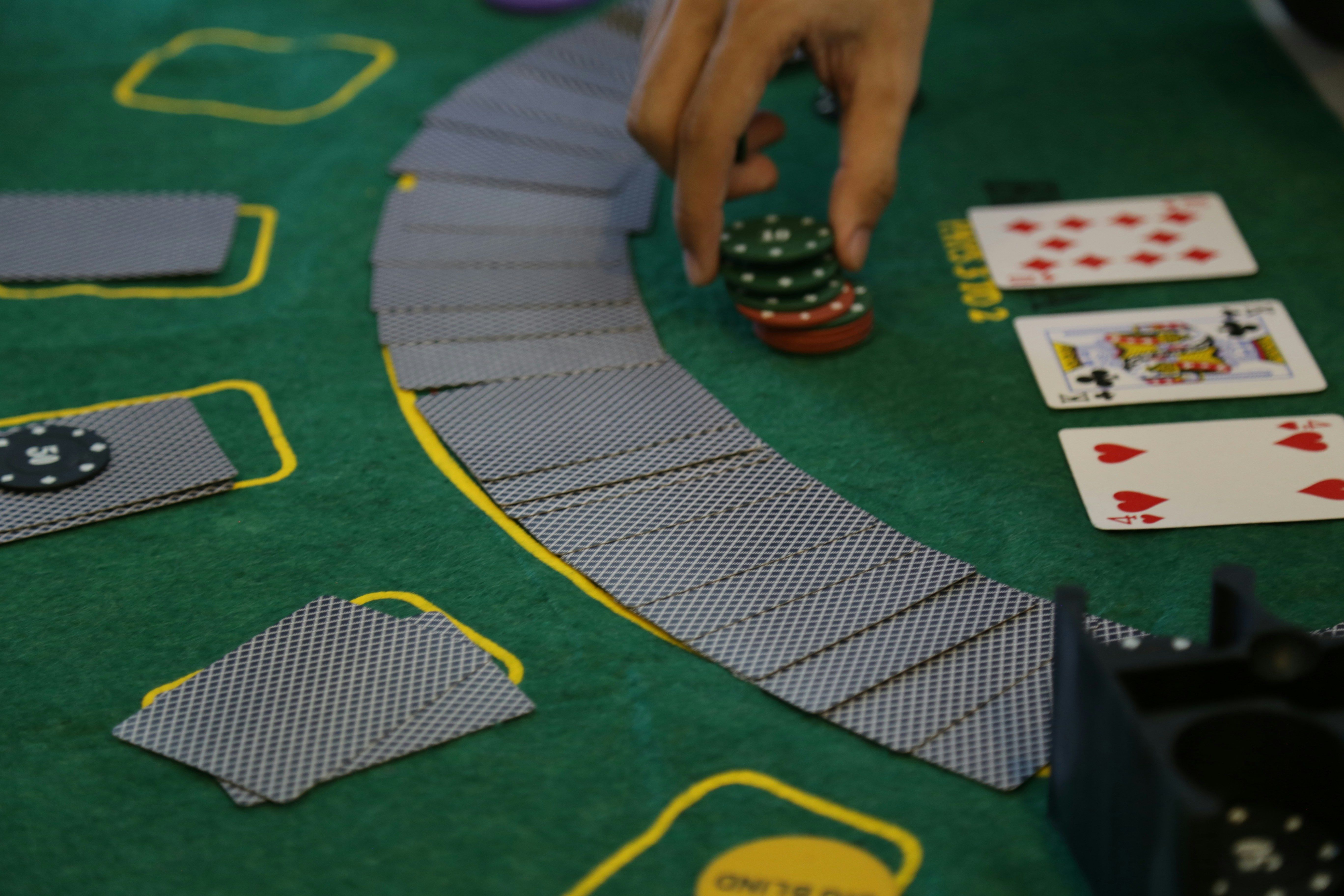 A person holding a casino chips