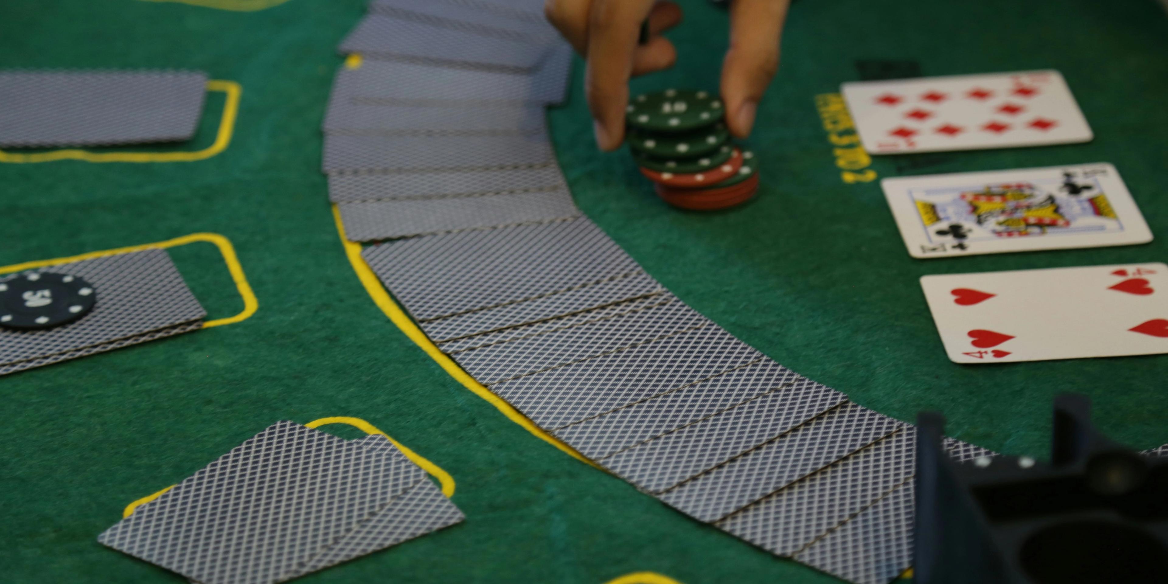 A person holding a casino chips