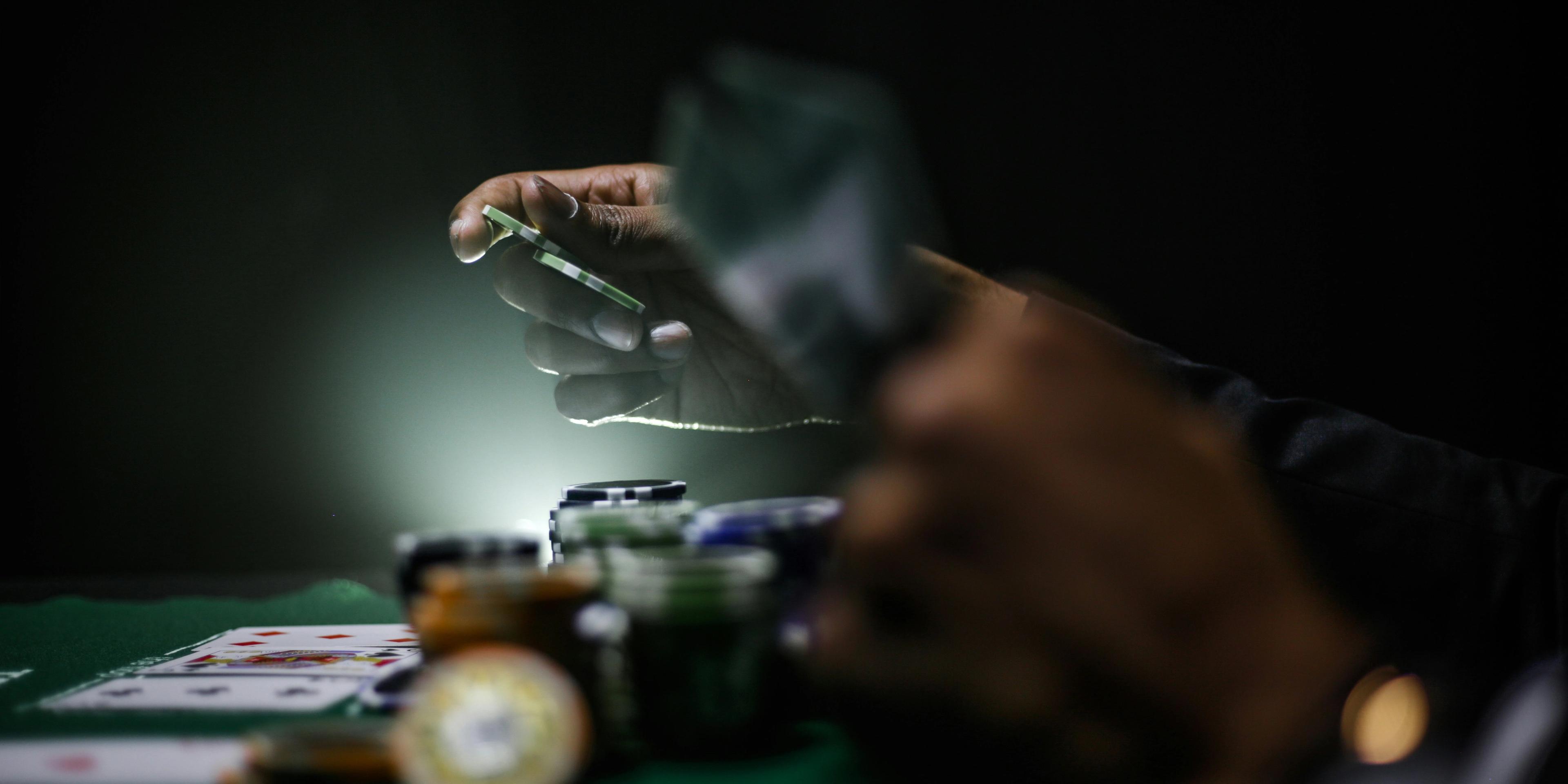 A person gambling on a table