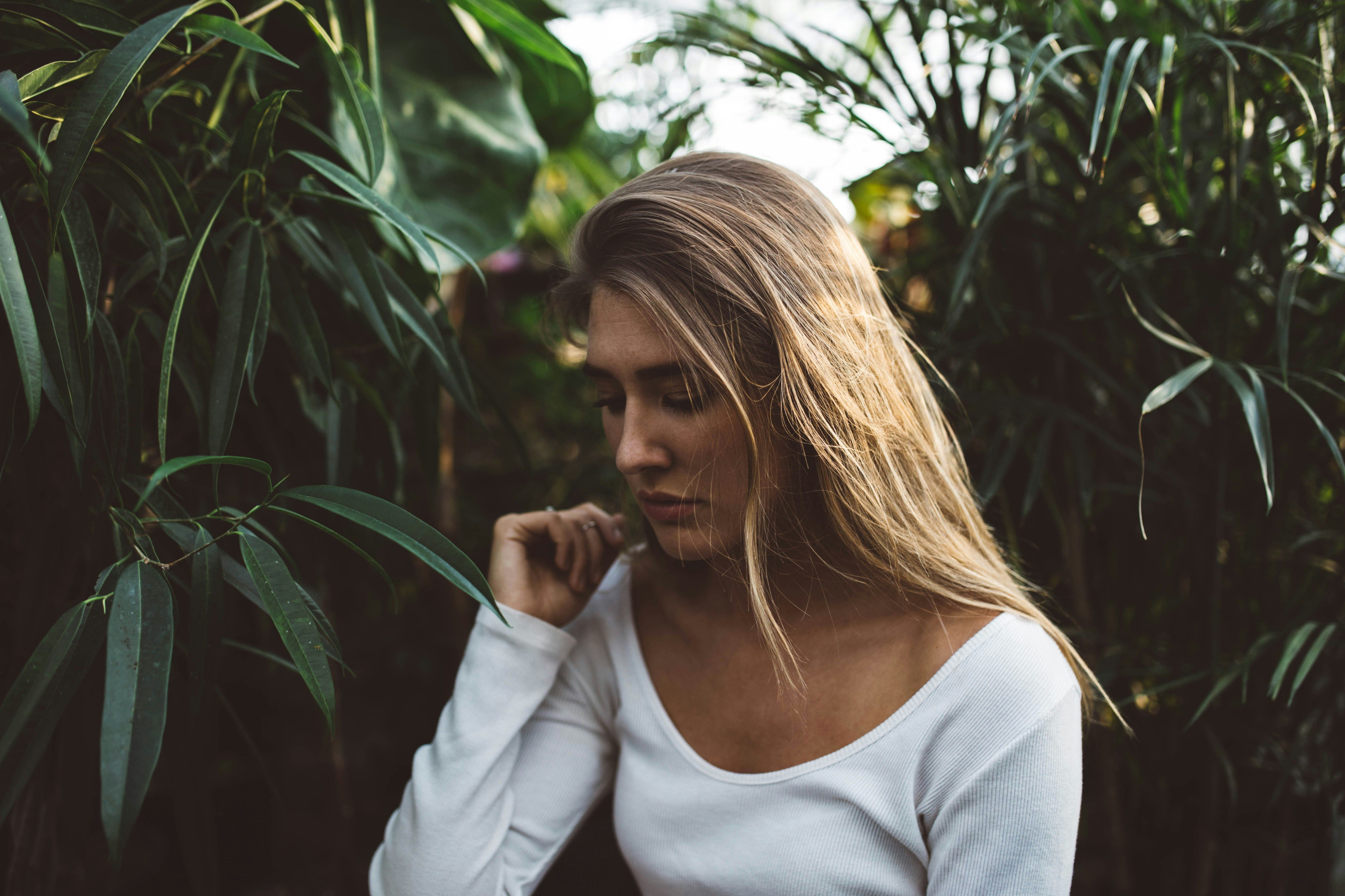A person surrounded by leaves