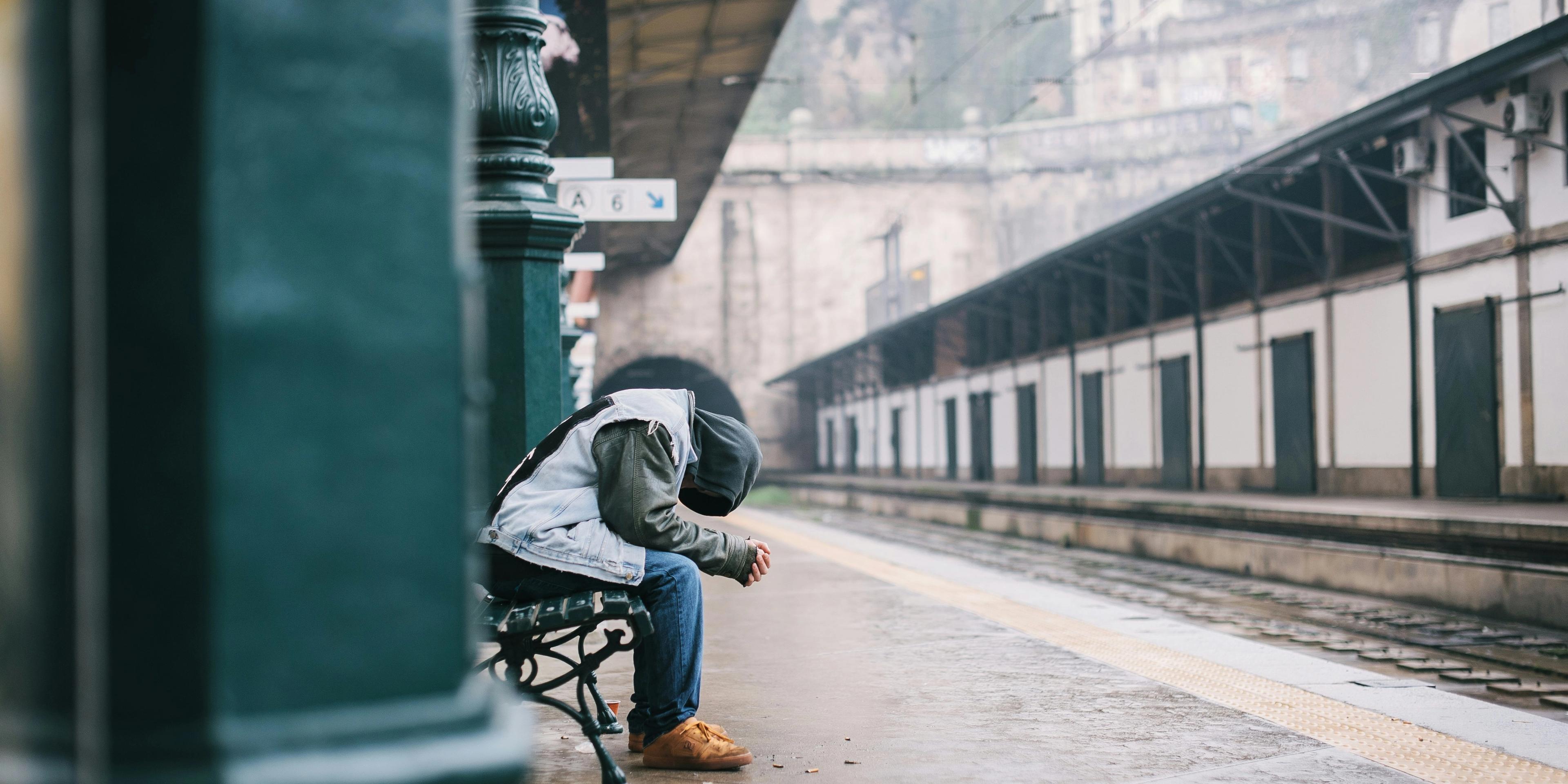 A person sitting on a bench