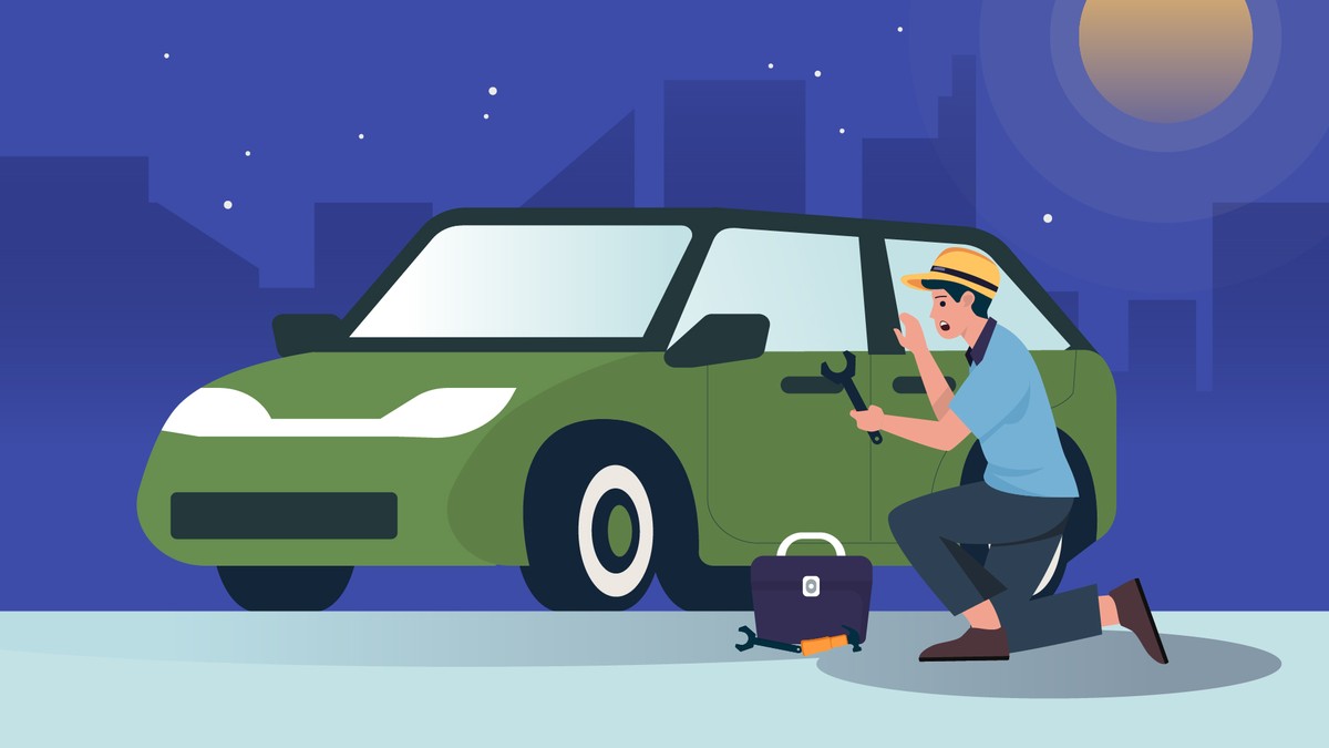 A locksmith opening a car door at night.