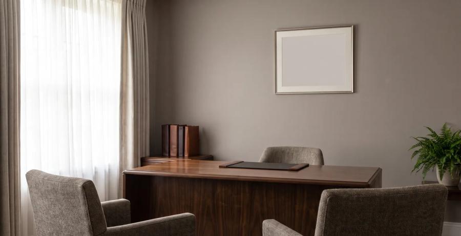 An empty, professional funeral home arrangement office, representing licensed funeral home staff and professional standards.