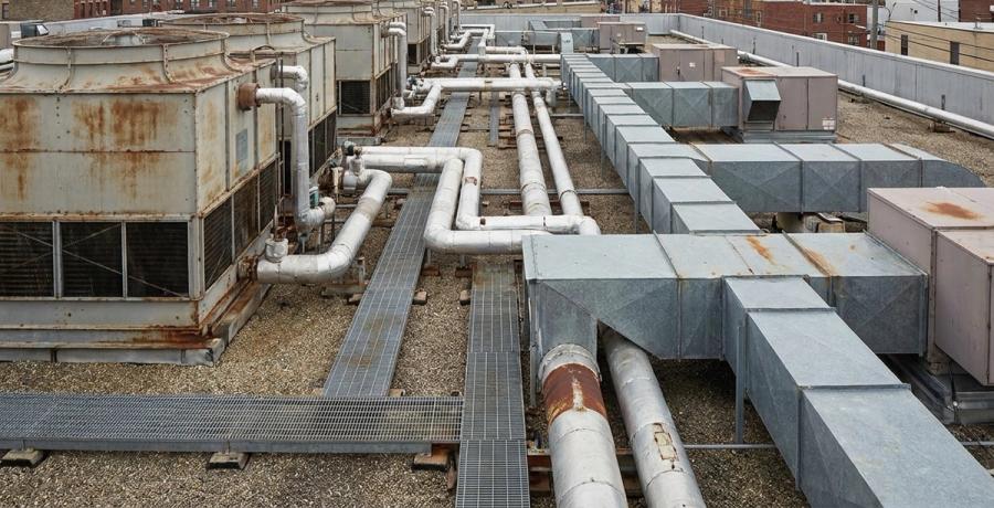 Cooling towers and mechanical equipment on a commercial building rooftop.