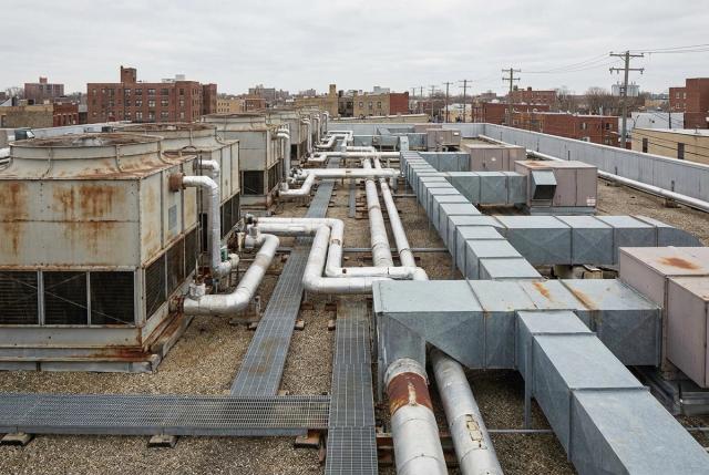 Cooling towers and mechanical equipment on a commercial building rooftop.