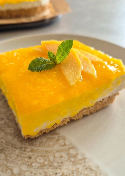 Schnelles No Bake Schichtdessert mit Mangotopping und frischkäse-Quark-Creme.