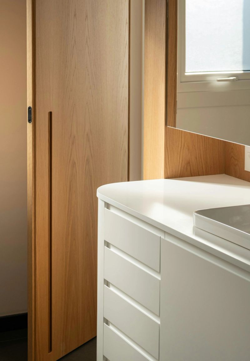 Light oak flush interior door with slim black pull