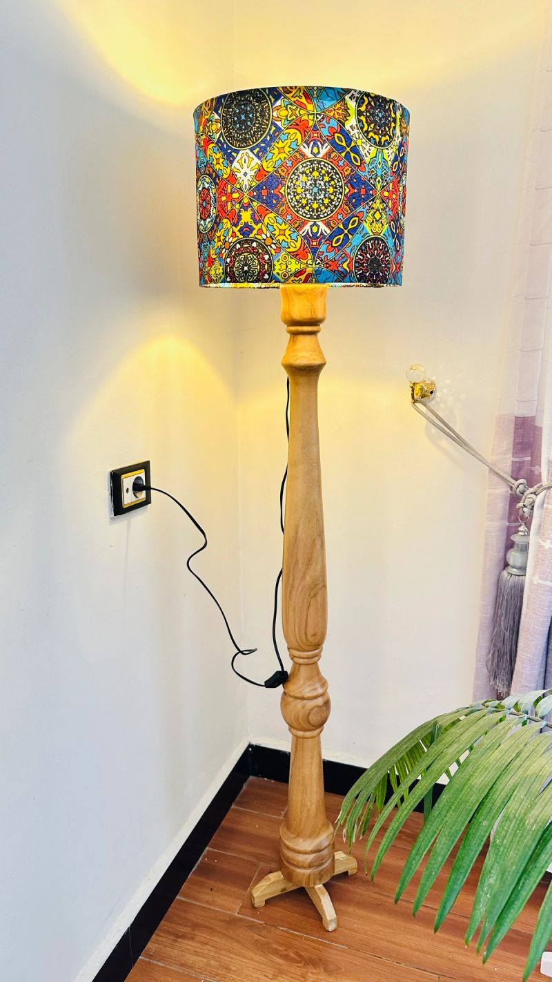 Carved wood floor lamp with patterned drum shade