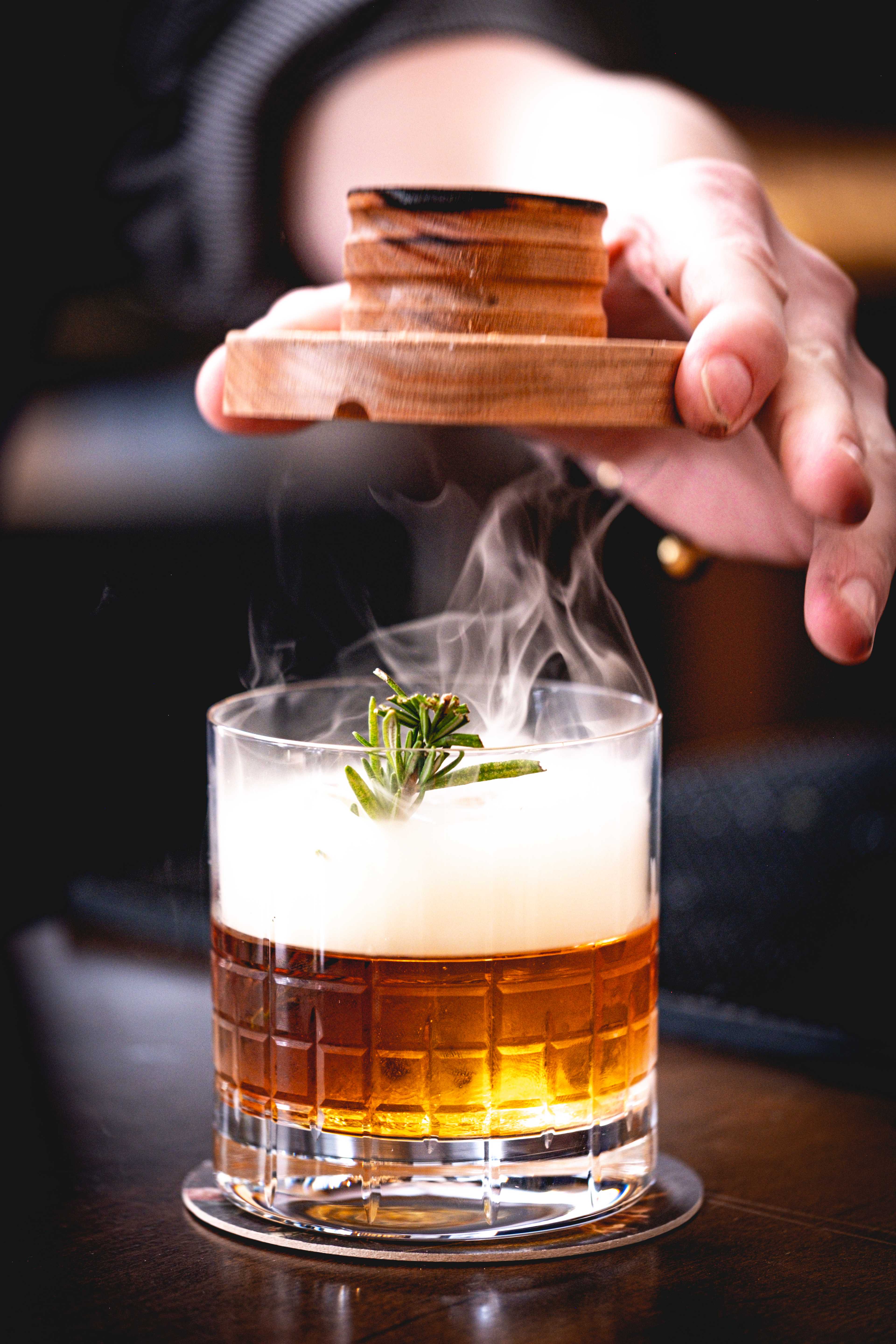 glass with whiskey and smoke