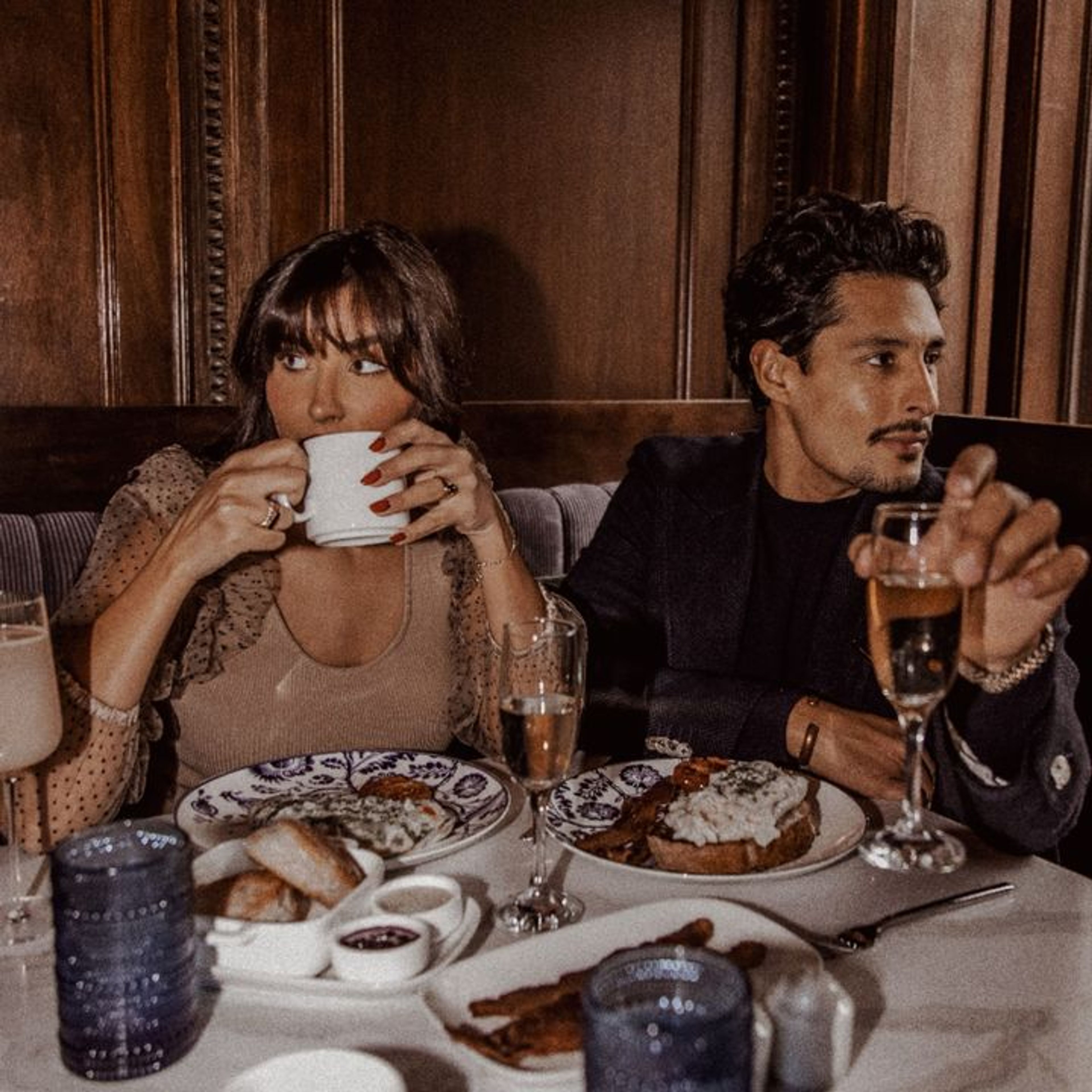 girl and man are drinking coffee.