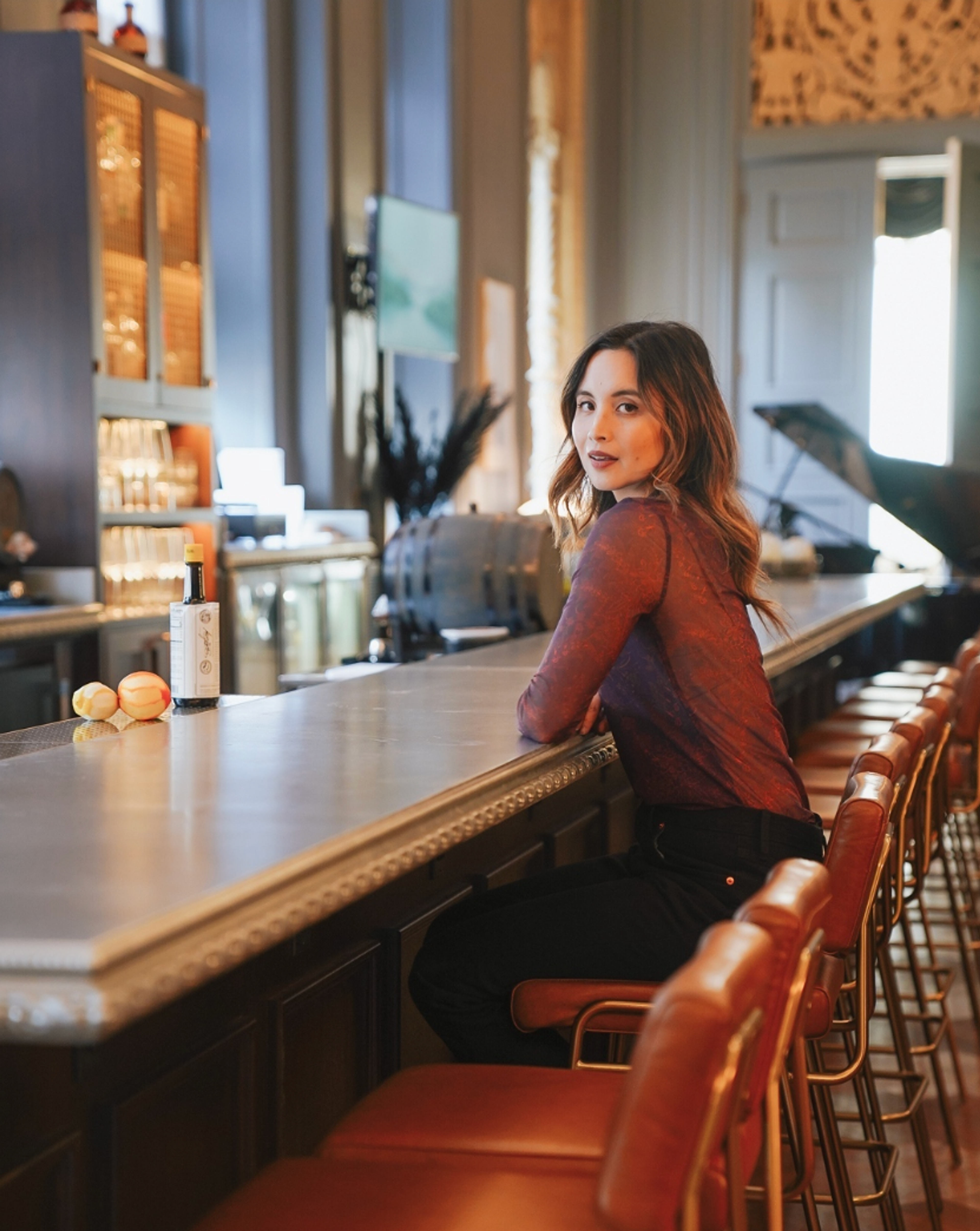 woman sitting at the bar
