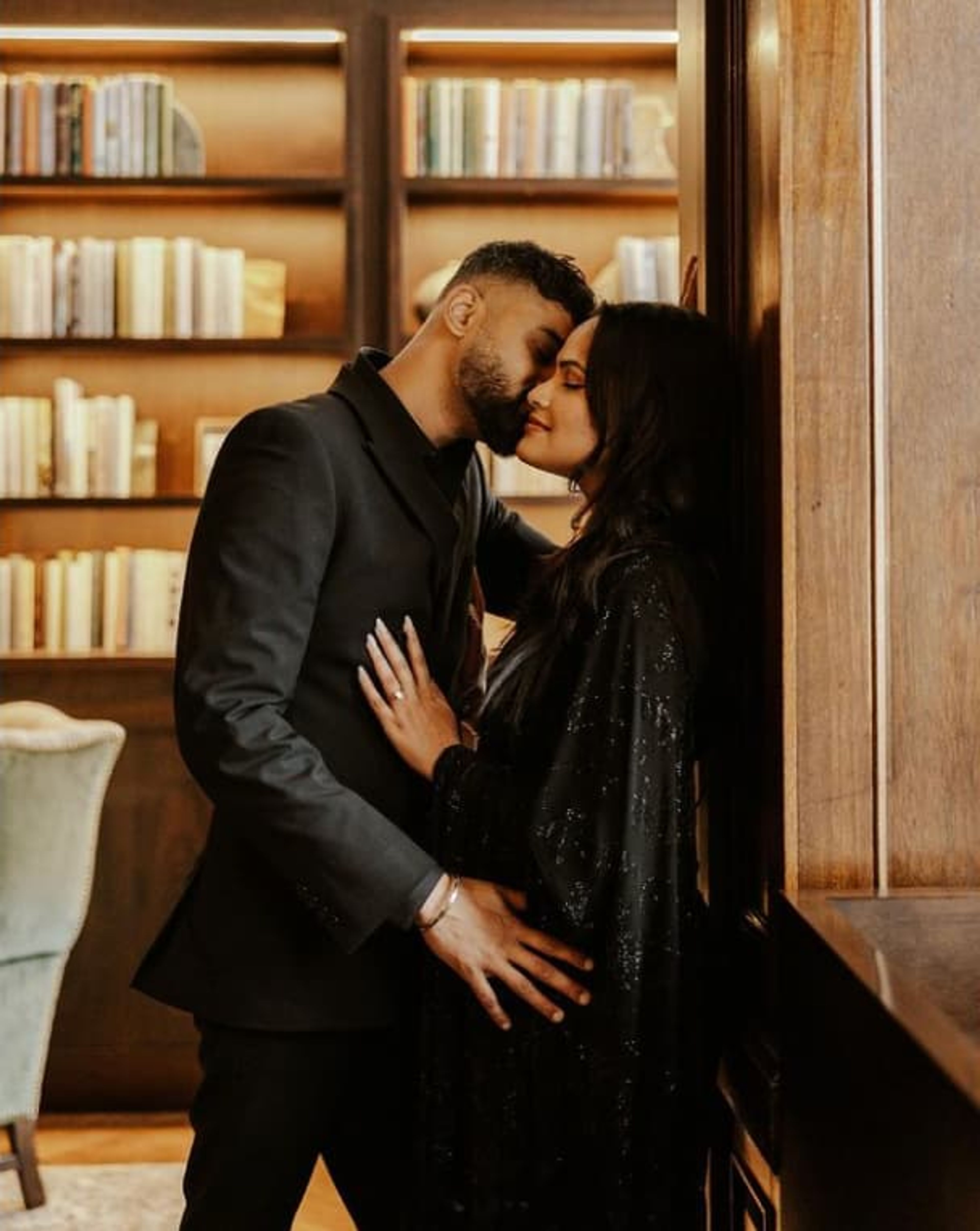couple in whiskey library.