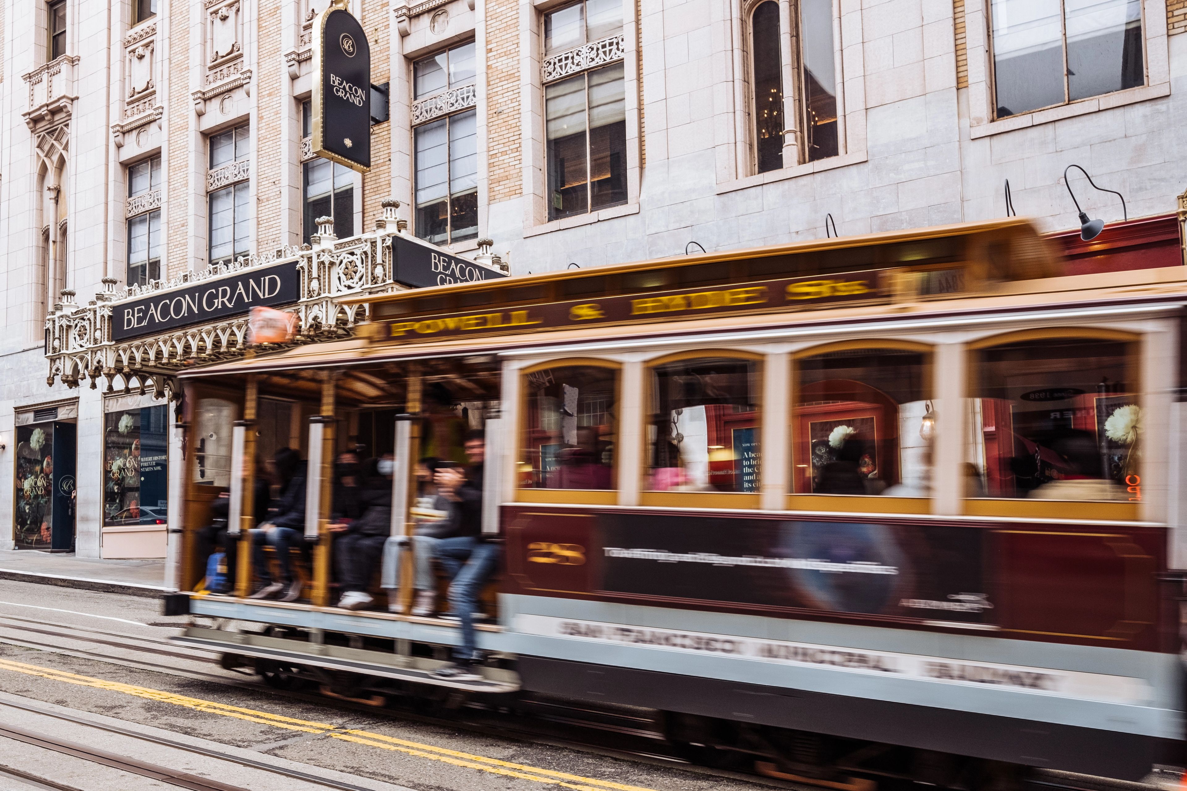 Beacon Grand - cable car traveling down a city street.