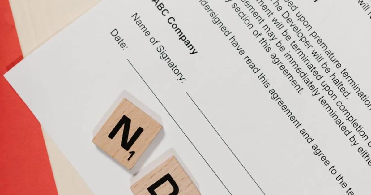 A professional reviewing a digital contract for ADA Title II vendor governance compliance.