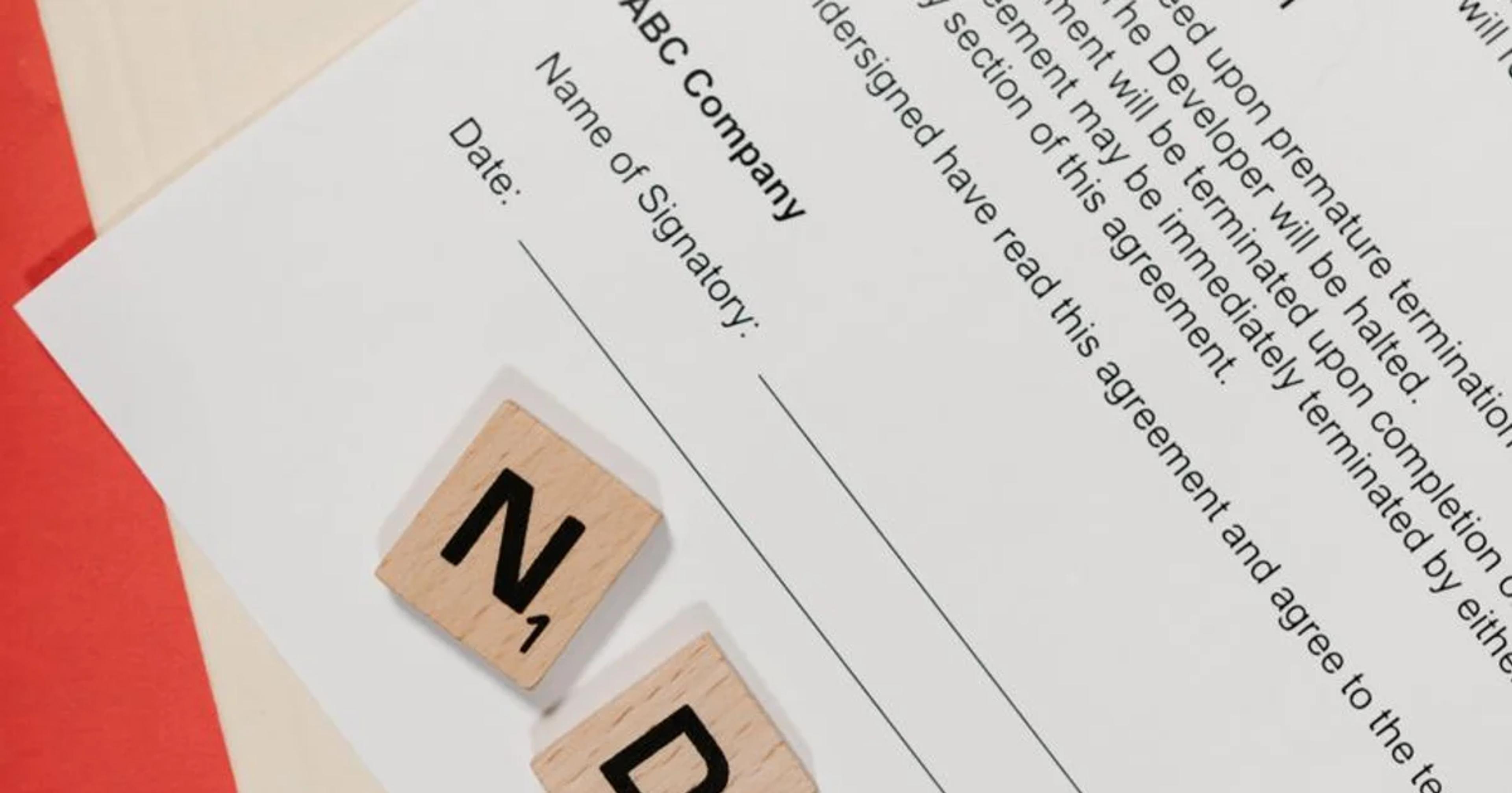 A professional reviewing a digital contract for ADA Title II vendor governance compliance.