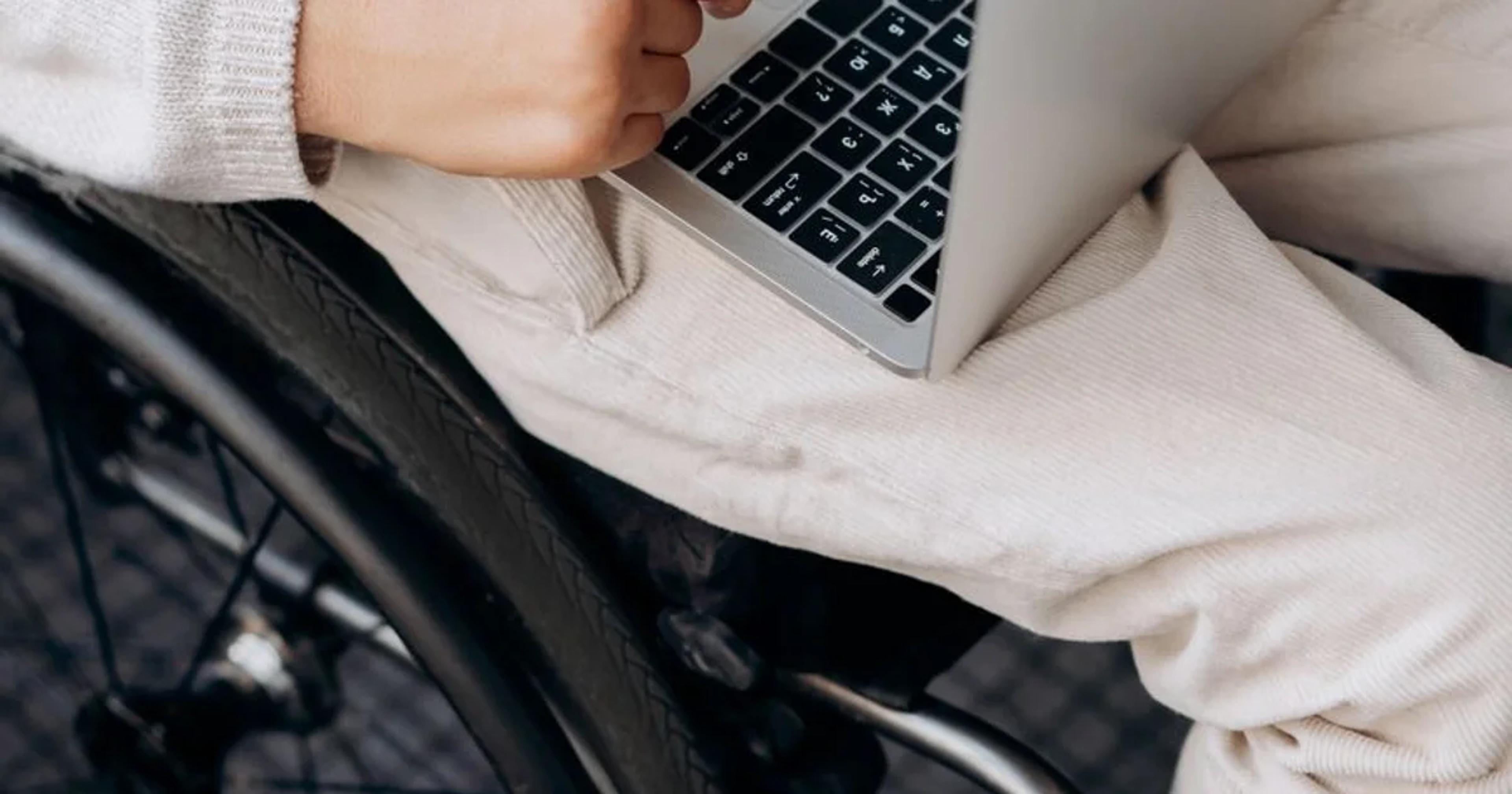 A professional analyzing ADA compliance software for civic cybersecurity on a laptop