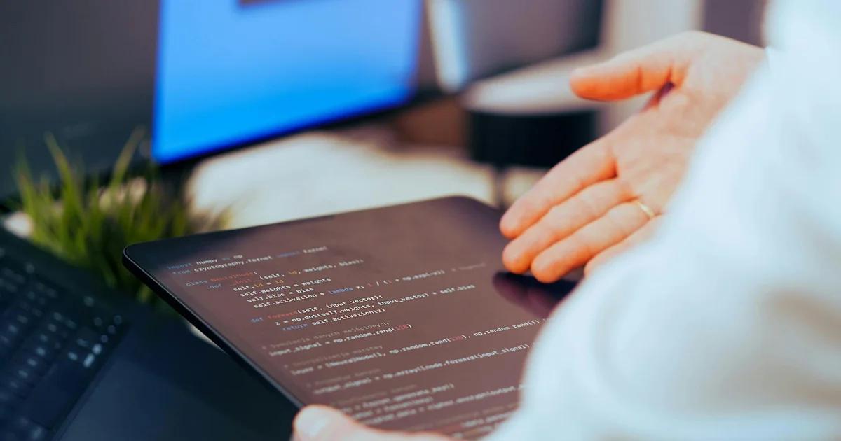 A developer reviewing code to eliminate accessibility debt and maintain digital compliance