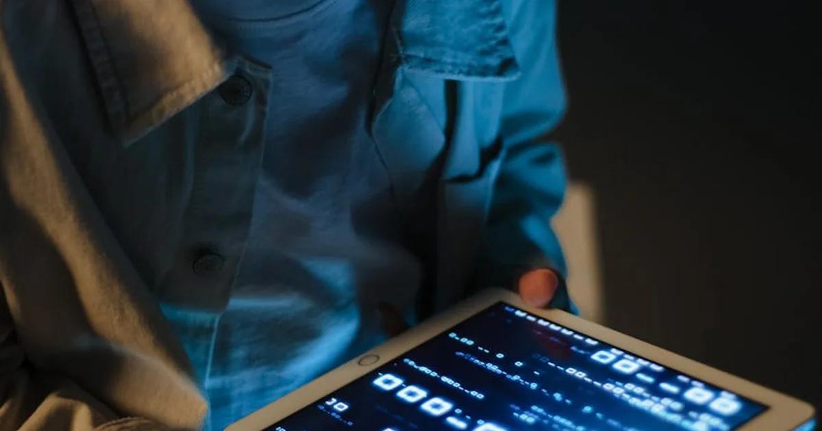 A diverse group collaborating on computers, symbolizing the effort in remediating legacy public digital content.