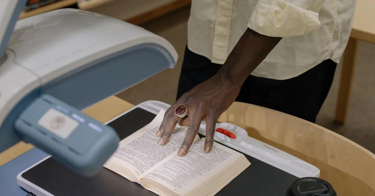 A public sector employee navigating a digital archive platform designed for ADA compliance