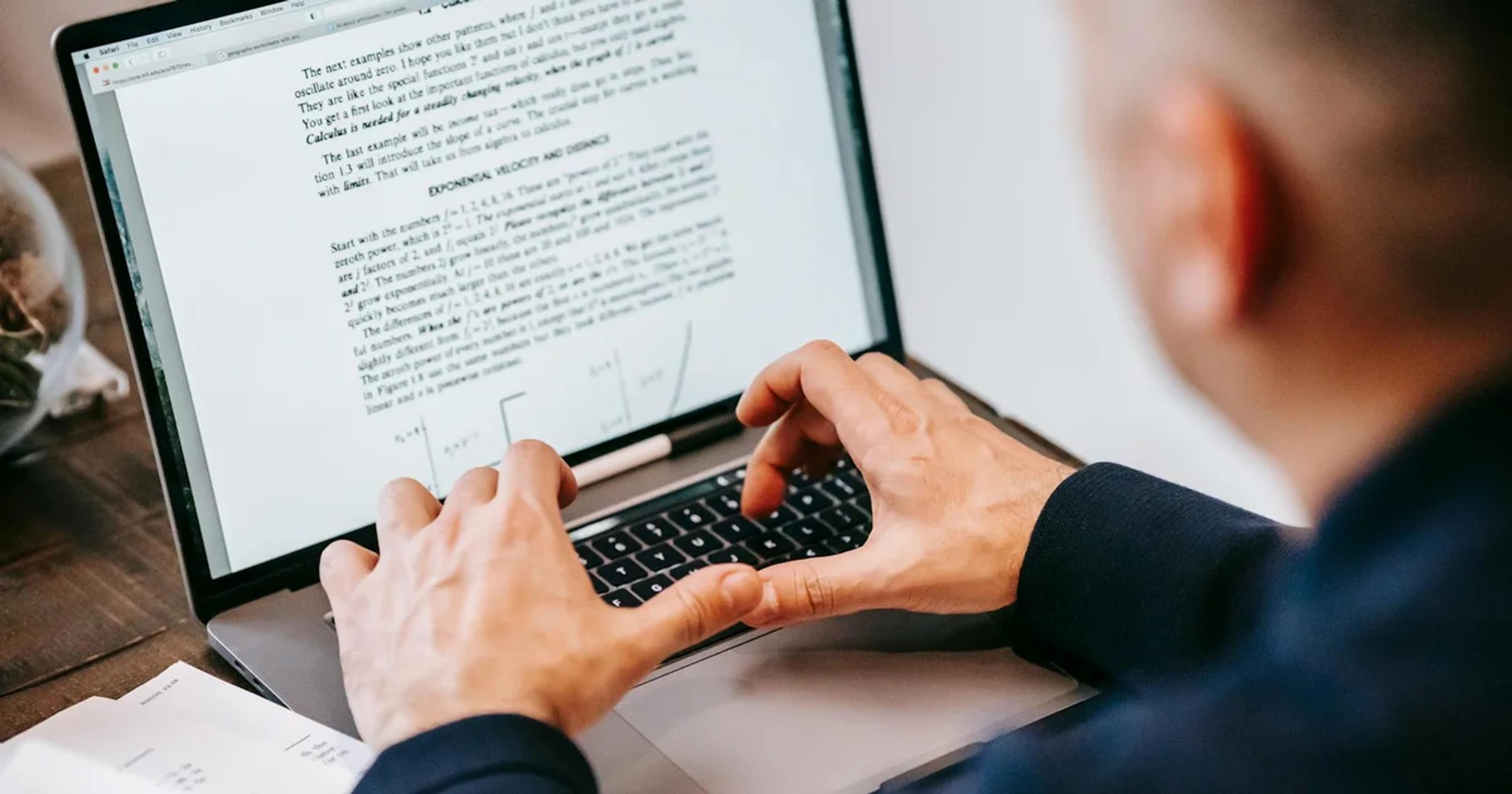 A professional reviewing digital ADA compliance and offline continuity documents